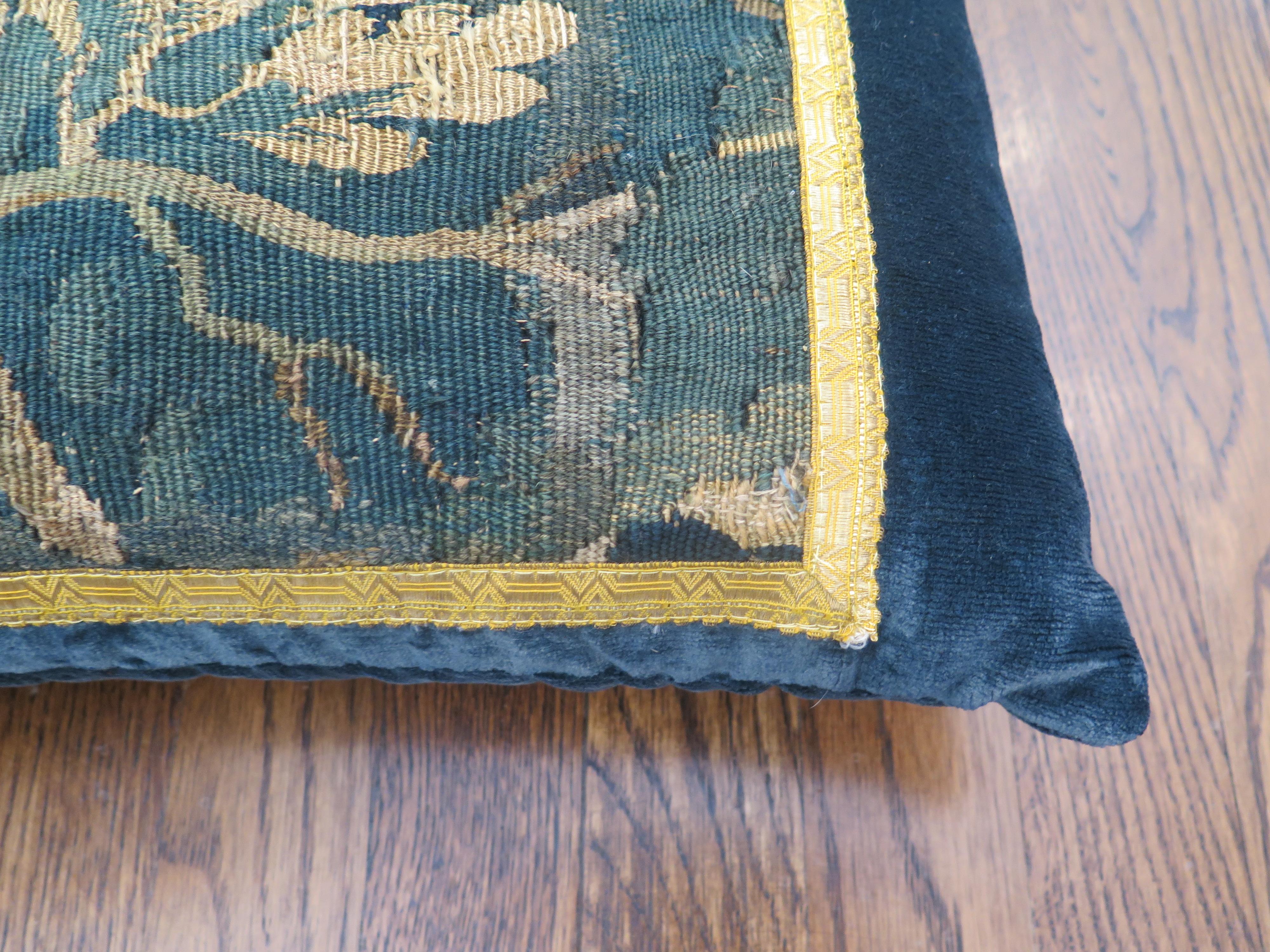 Custom 18th century verdure tapestry pillow in marine blue linen velvet and gold metallic trim. Down filled.