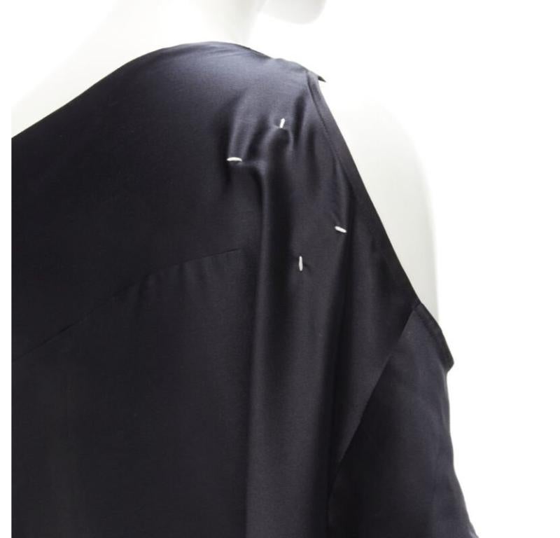 MAISON MARGIELA 2005 Vintage 100% silk black sideways off shoulder top IT42 M
Reference: TGAS/C01158
Brand: Maison Margiela
Designer: Martin Margiela
Material: Silk
Color: Black
Pattern: Solid
Closure: Button
Extra Details: Intended design like a