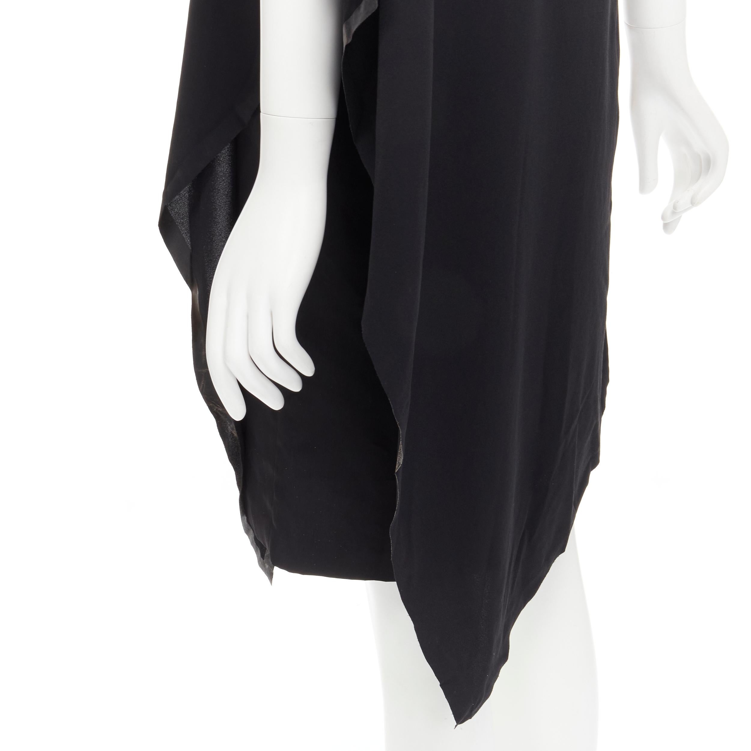 MAISON MARGIELA 2013 black polyester V-neck asymmetric bonded cape dress IT40 S 
Reference: KEDG/A00055 
Brand: Maison Mariglea 
Collection: 2013 
Material: Italy 
Color: Black 
Pattern: Solid 
Extra Detail: Bonded along edges at lining. 
Made in: