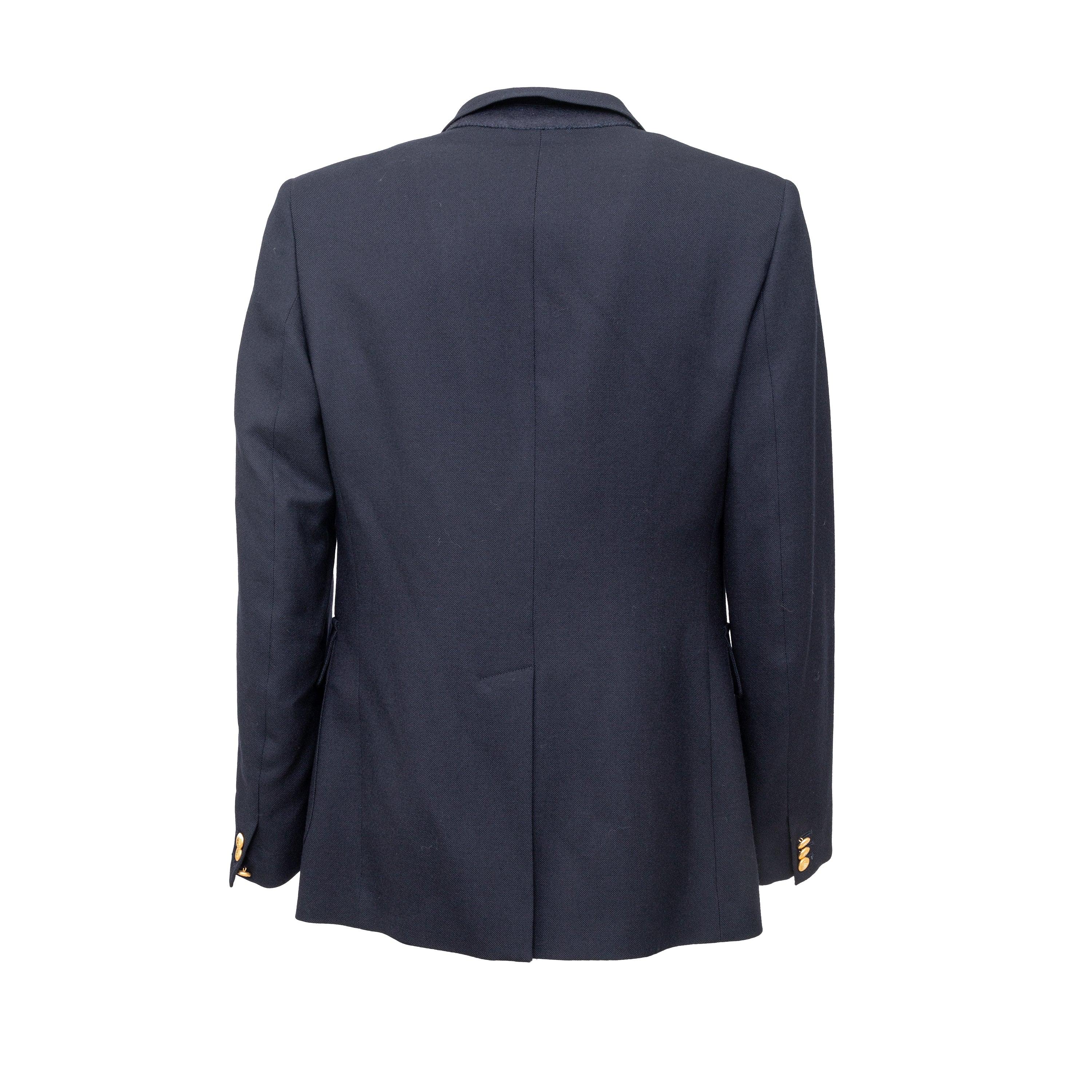 Experience vintage elegance with the Maison Margiela 50s Replica Harvard Blazer. Crafted from 100% wool in regal navy blue, this blazer from the Replica label is a reproduction of a 1950s classic. The golden tone buttons add a touch of