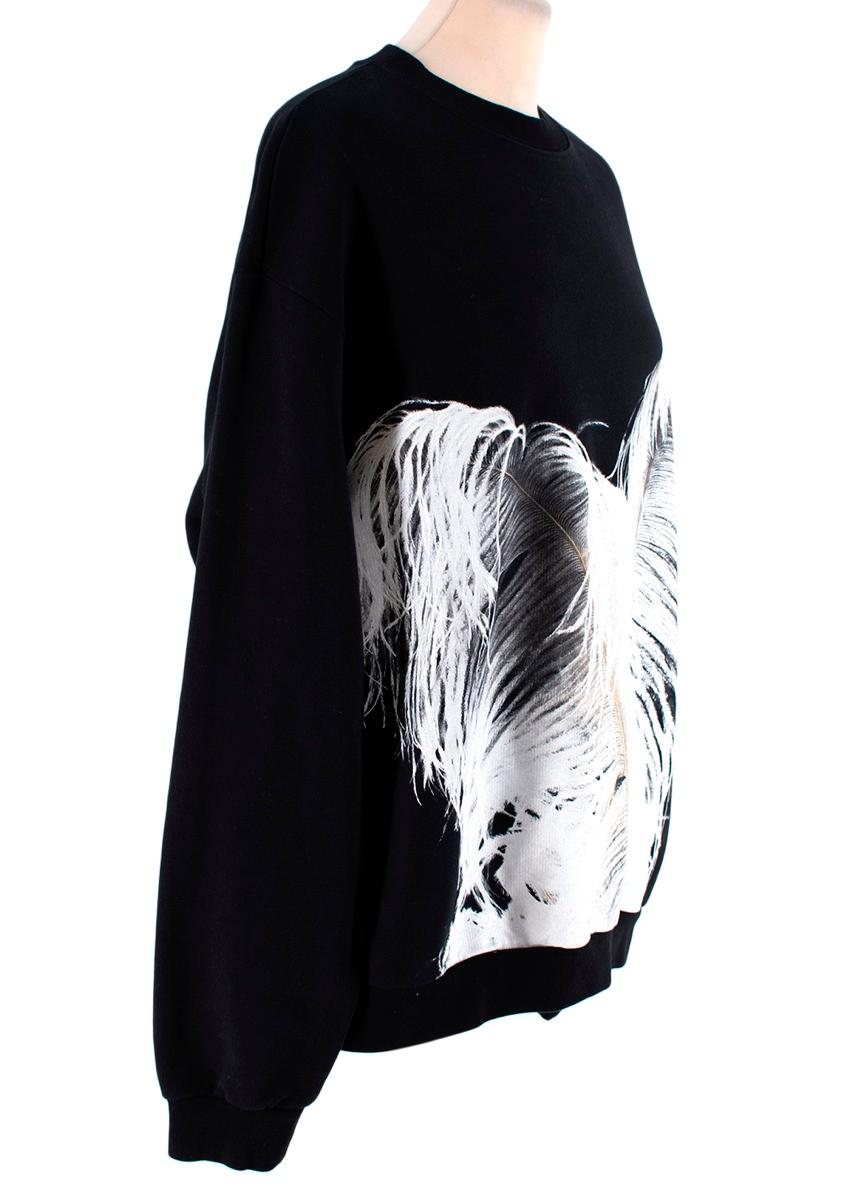 Maison Margiela Black Feather Print Sweatshirt 
 

 - Crafted from soft black cotton and cut to a loose fit
 - Feather print sweatshirt is detailed with the Maison's iconic 'ghost' quad stitching to the back of the neckline
 - A ribbed crew neck,
