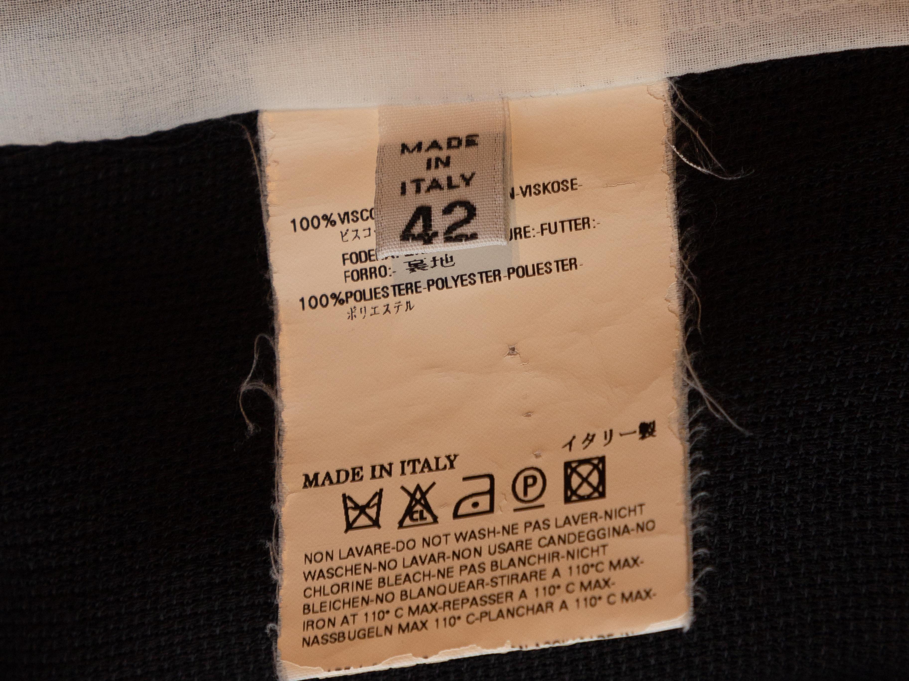 Product details: Black lightweight blazer by Maison Margiela. Peaked lapel. Single welt pocket at bust. Dual hip pockets. Button closure at front. Designer size 42. 40