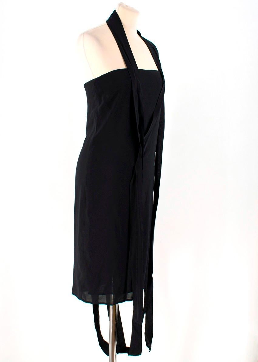 Maison Margiela Black Strappy Dress

- Black Dress
- Racer back straps, one shoulder
- Decorative straps down dress
- Zip fastening closure at back of dress

Please note, these items are pre-owned and may show some signs of storage, even when unworn