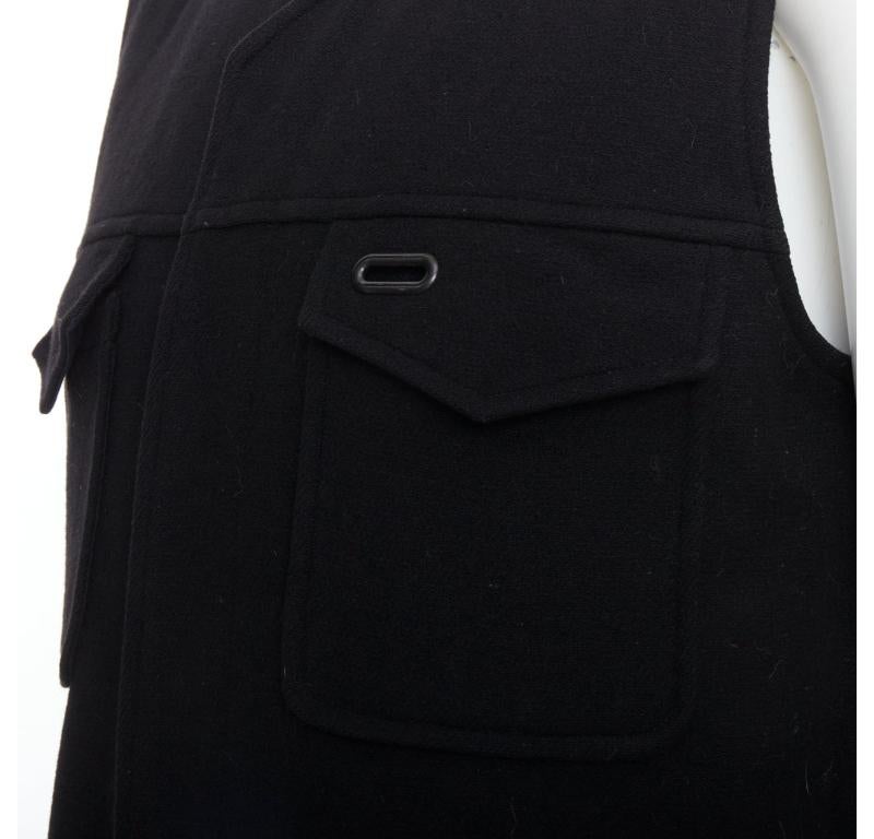 MAISON MARGIELA black wool blend oval grommet pocket vest IT46 S
Reference: PRWU/A00052
Brand: Maison Margiela
Designer: Martin Margiela
Material: Wood, Blend
Color: Black
Pattern: Solid
Closure: Snap Buttons
Lining: Black Fabric
Extra Details: