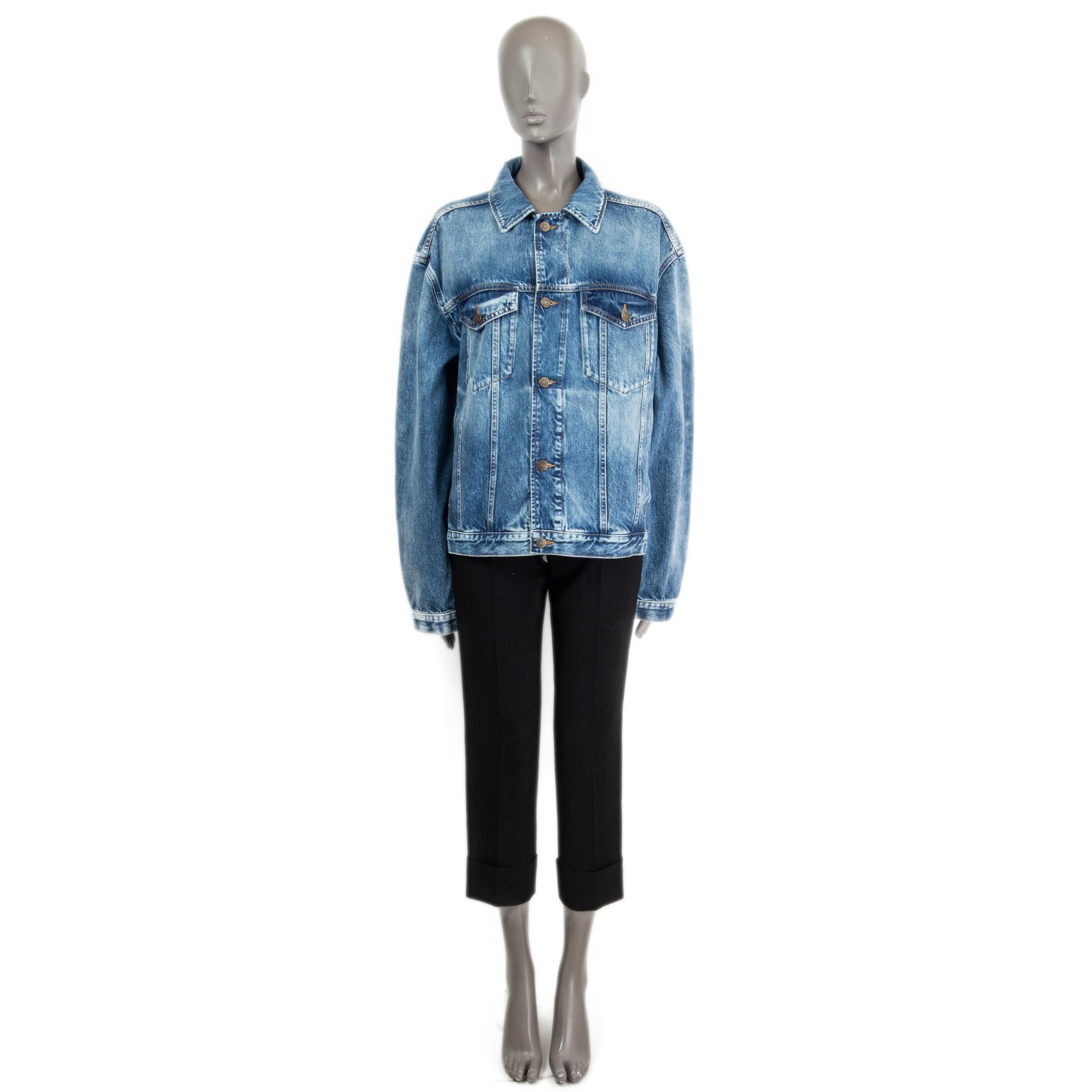 100% authentic Maison Margiela oversized washed-out denim jacket in blue cotton (100%). Opens with front buttons and is embellished with two front flap-pockets and two side slit-pockets. Has been worn and is in excellent condition.