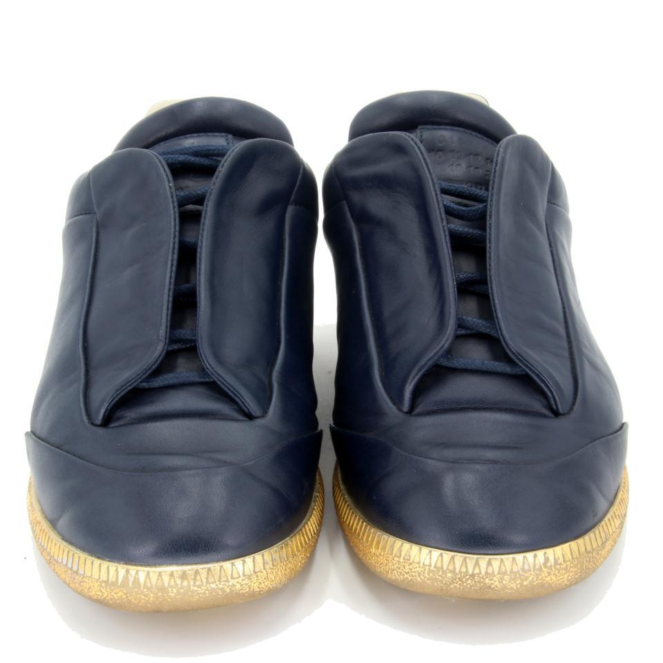 Maison Margiela Blue Future Low Top Trainers Sneakers

Here is another Gem brought to you by the world famous fashion House Maison Margiela Unisex Future Lows with elegnat blue leather and vivid gold sole these are a size 40 which is a womens 10 or