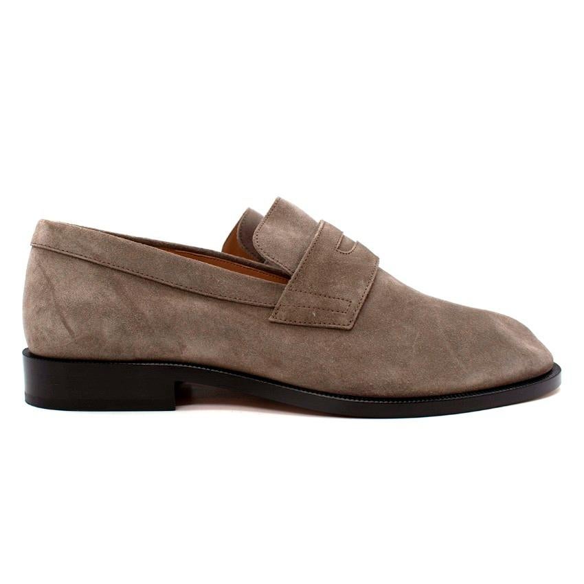Maison Margiela Grey Suede Tabi Loafers

- Signature Tabi cleft toe shape 
- Soft slip-on back
- Maison's iconic straight white stitch adorns the back heel
- Black sole set on low block heel 

Materials:
Leather

Made in Italy

PLEASE NOTE, THESE