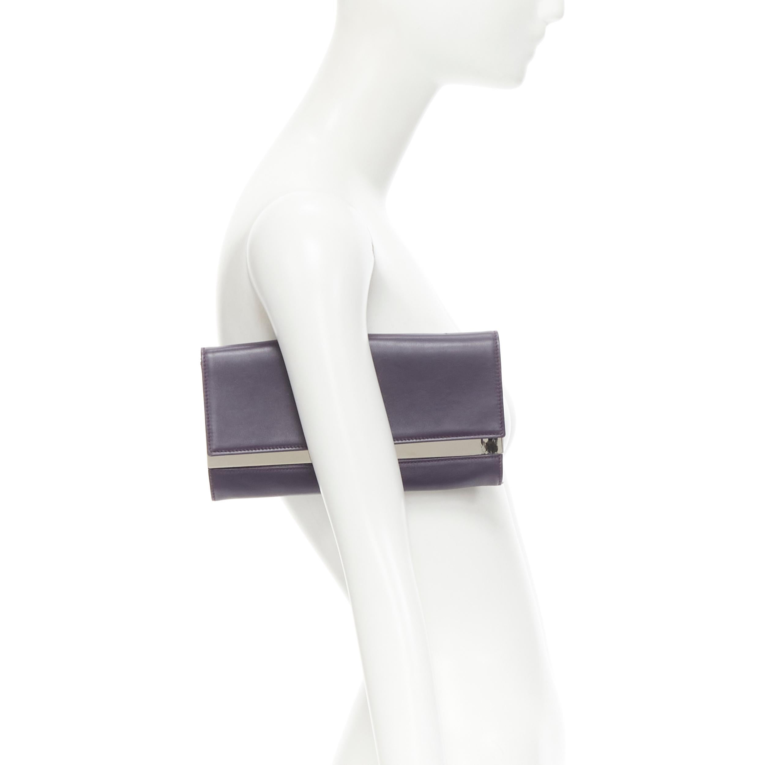 MAISON MARGIELA MMM purple leather mirrored interior flap clutch bag 
Reference: JNWG/A00019 
Brand: Maison Martin Margiela 
Material: Leather 
Color: Purple 
Pattern: Solid 
Closure: Button 
Extra Detail: Dark purple leather. Silver mirror plate at