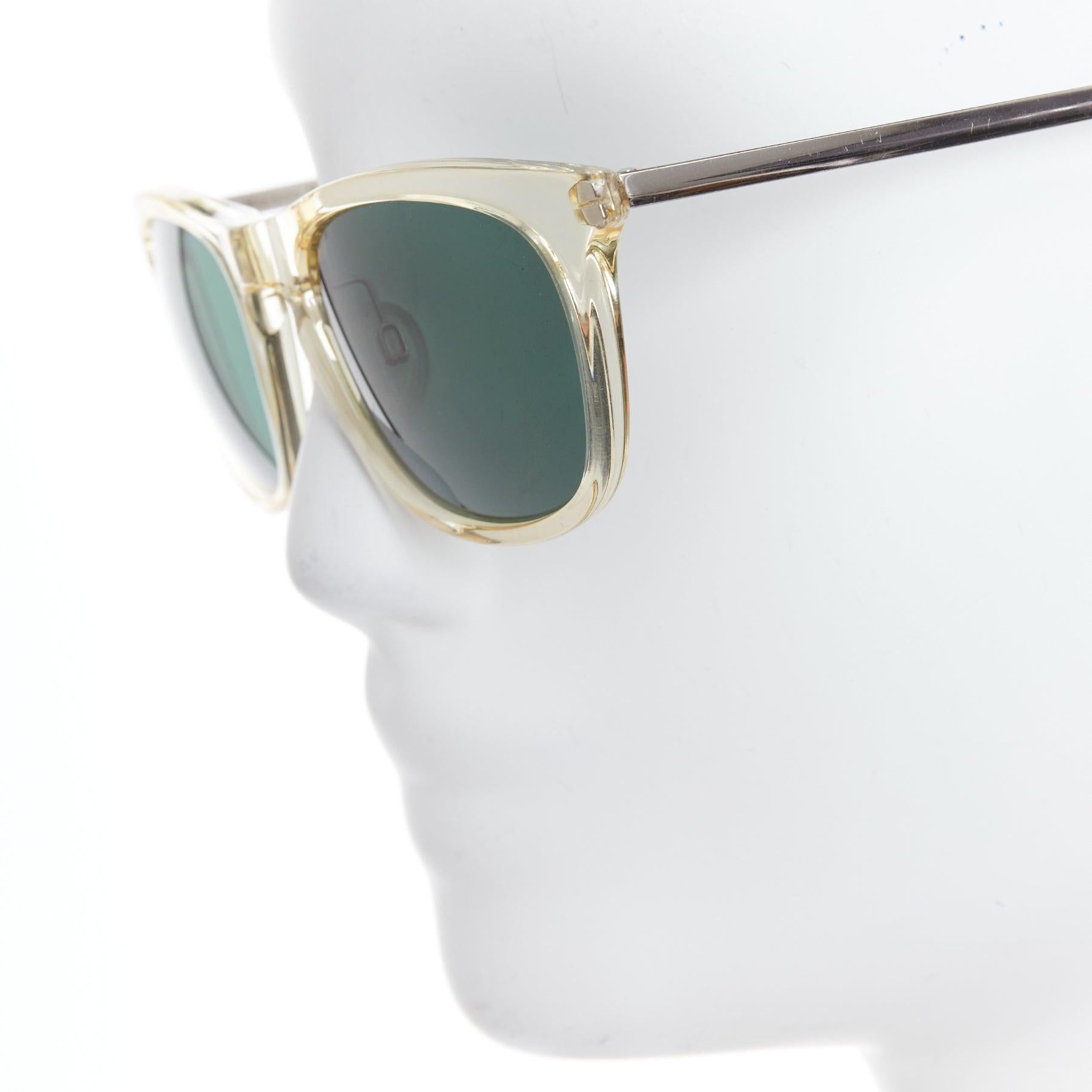 MAISON MARGIELA MMM06LBR Sonnenbrille mit klarem Kunststoffrahmen und silbernem Kabel an den Bügeln im Angebot 1