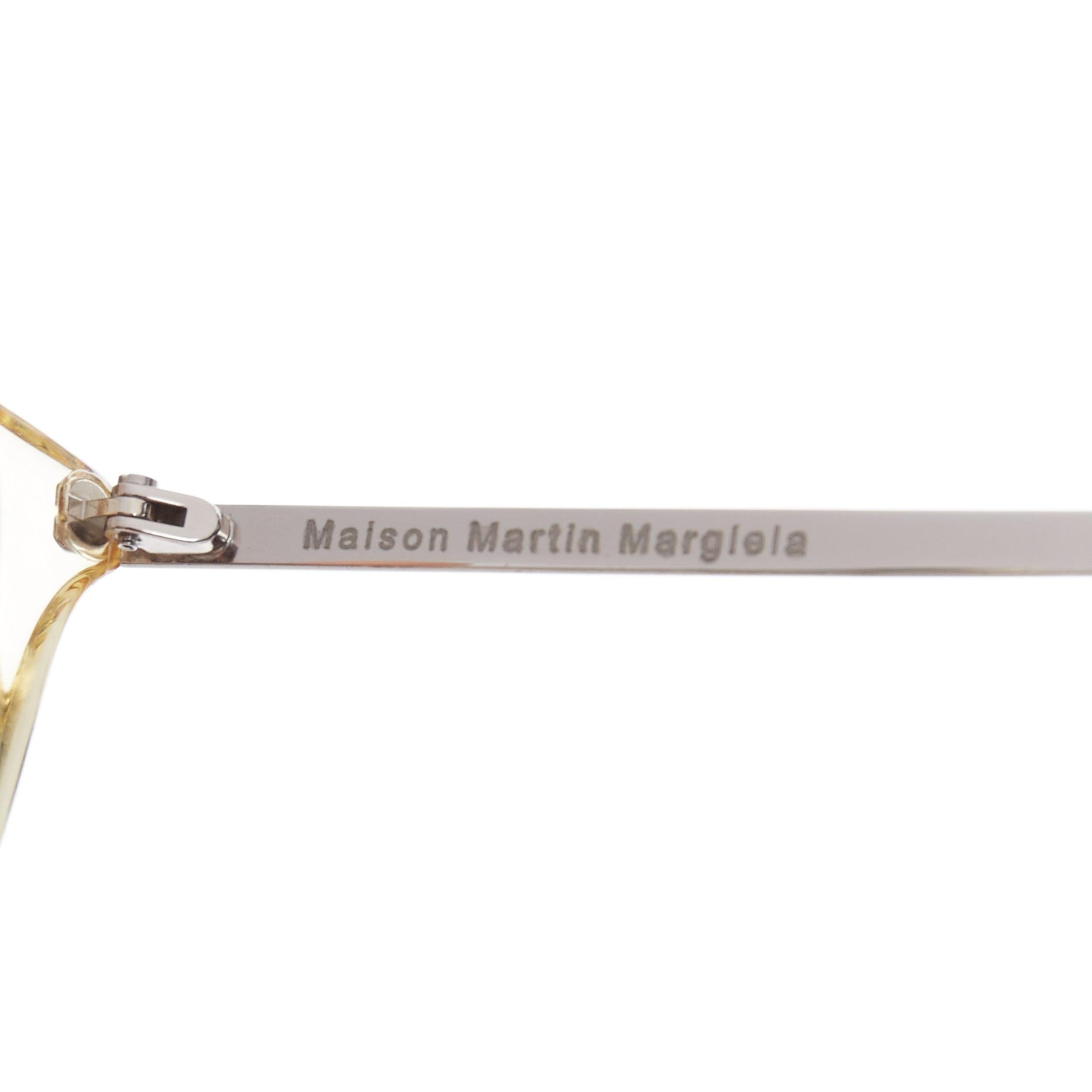 MAISON MARGIELA MMM06LBR Sonnenbrille mit klarem Kunststoffrahmen und silbernem Kabel an den Bügeln im Angebot 2