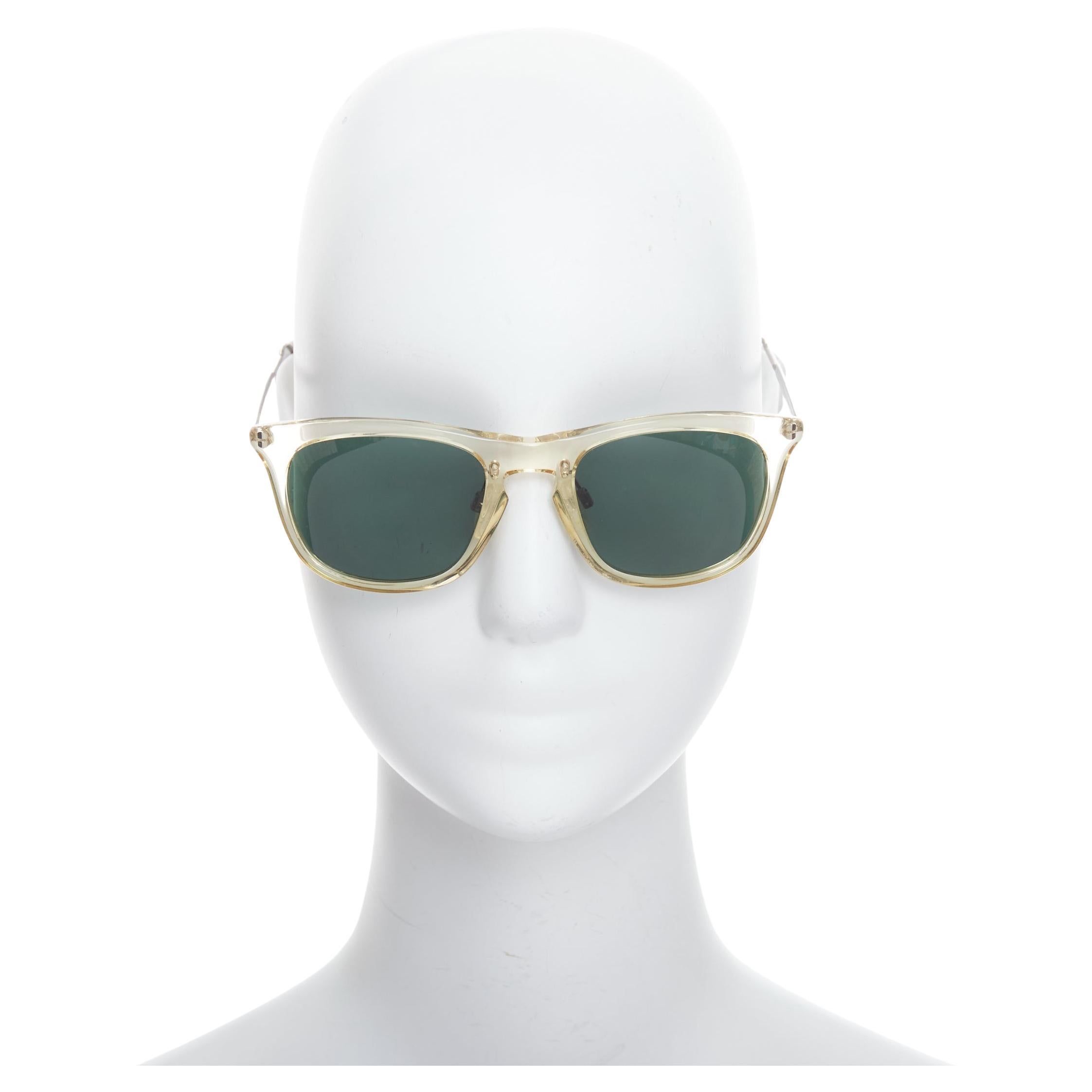 MAISON MARGIELA MMM06LBR Sonnenbrille mit klarem Kunststoffrahmen und silbernem Kabel an den Bügeln im Angebot
