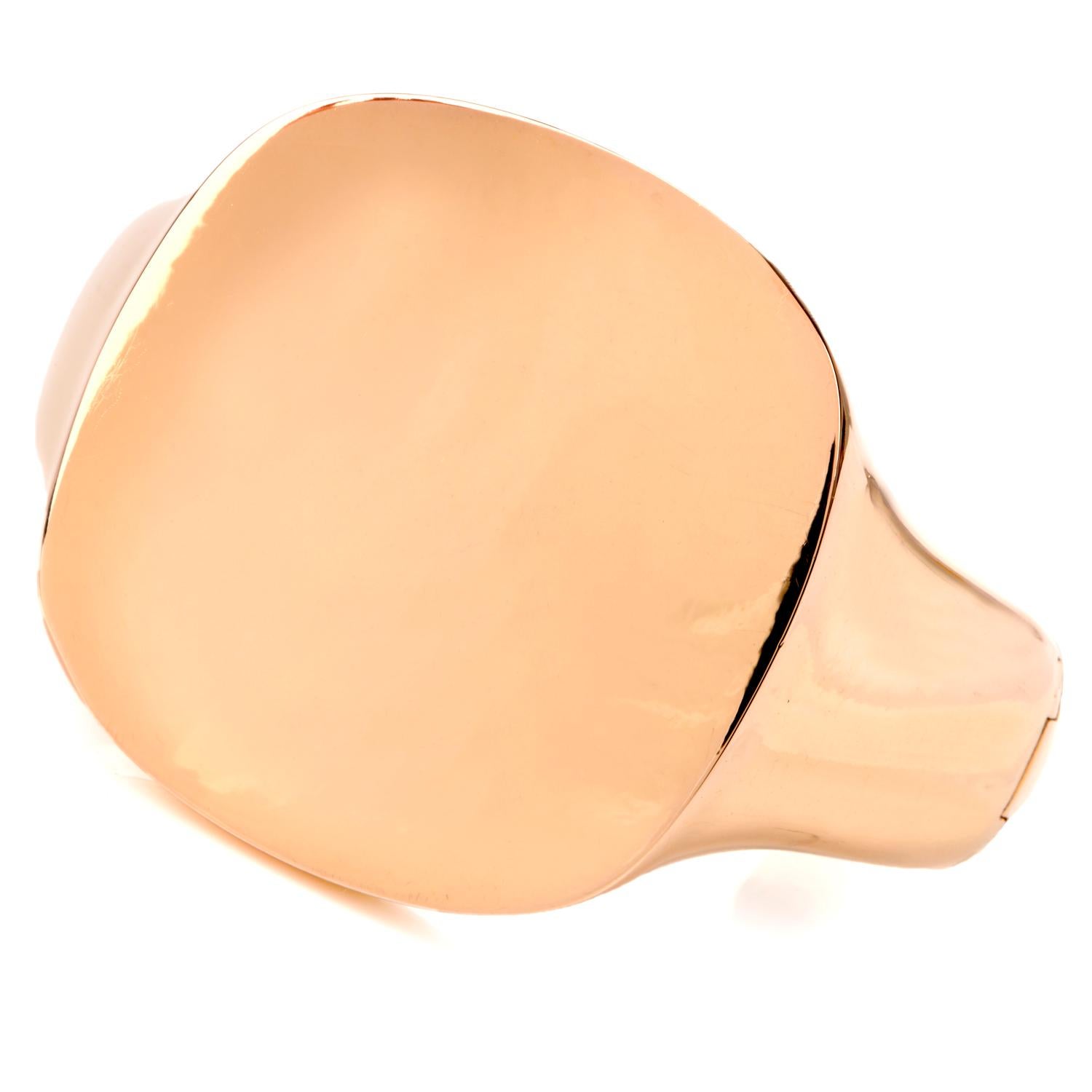 This chic and fashionable wide cuff bracelet is crafted in solid 18 karat rose gold, weighing 148.50 grams.
Exposing a centered rounded square face. Measuring 7 inches around the wrist and very close to 2 inches width, with expandable hinge opening.