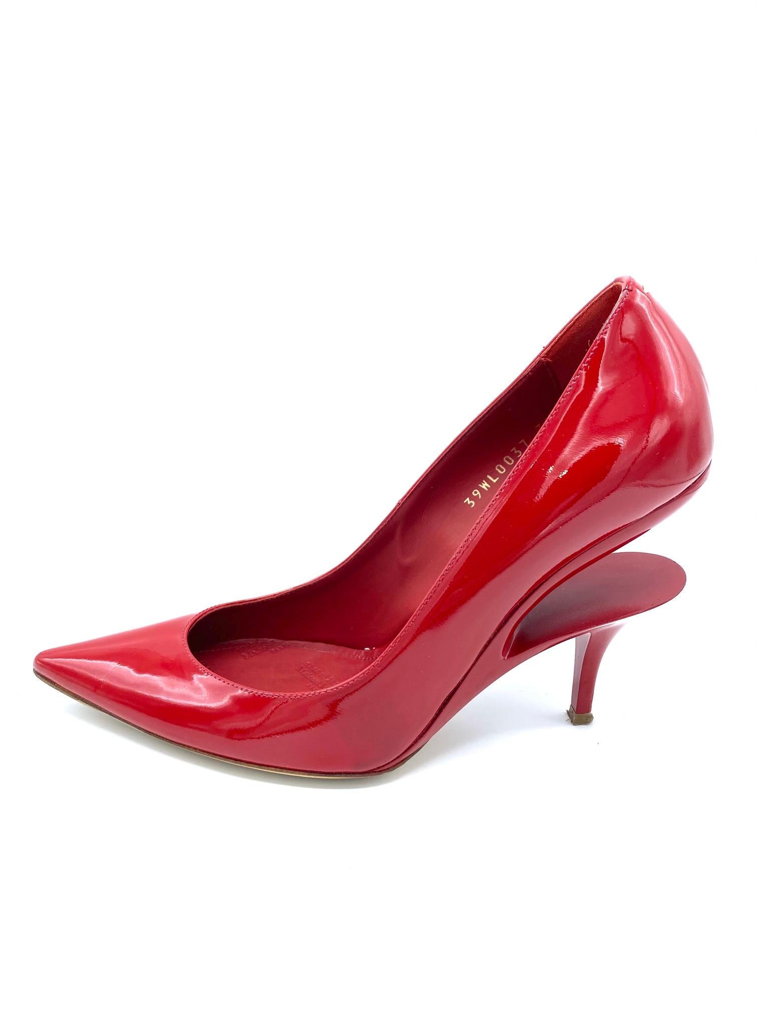 Product details:

Featuring red patent leather, ghost wedge pump heel and pointy toe, heel height is 4.25
