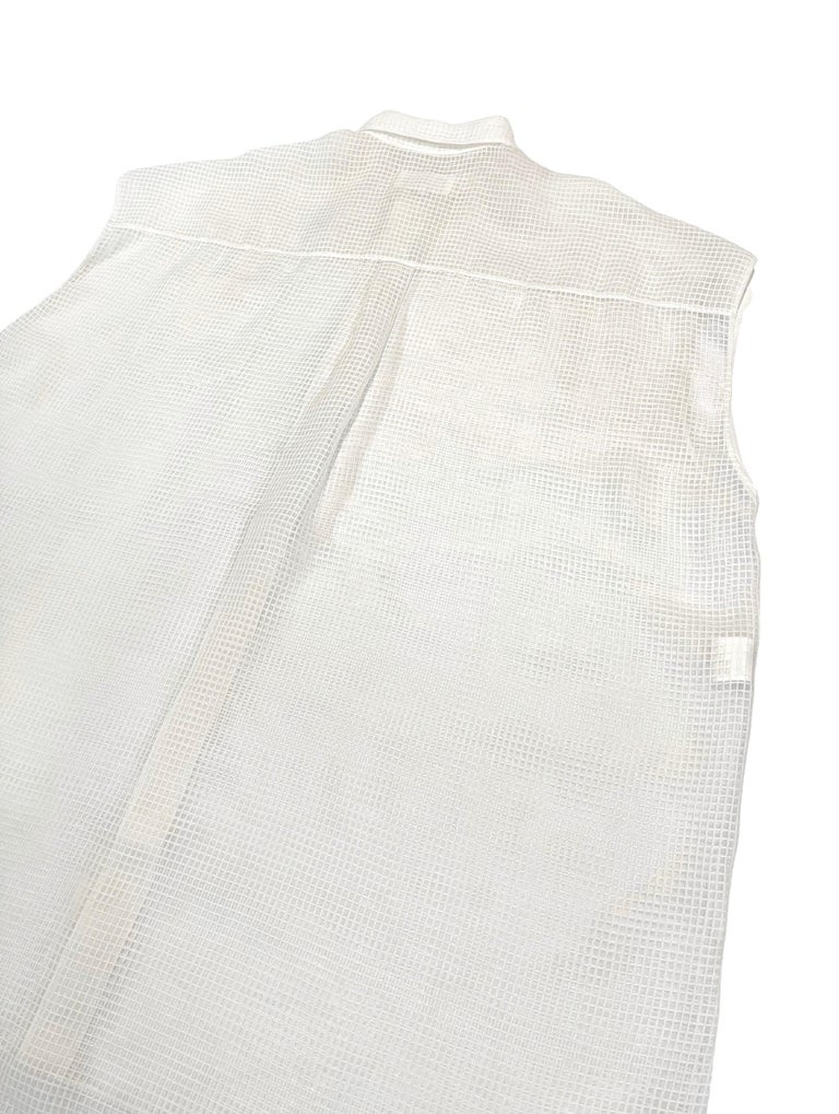 Line 1 piece by Margiela S/

Silhouette: Relaxed fish net shirt, sleeveless

Fabric: Polyester

Lining: None

Season: Spring Summer 2020

Pocket: Front x 2

Weight: 

Color: White

Material:
Body: polyester