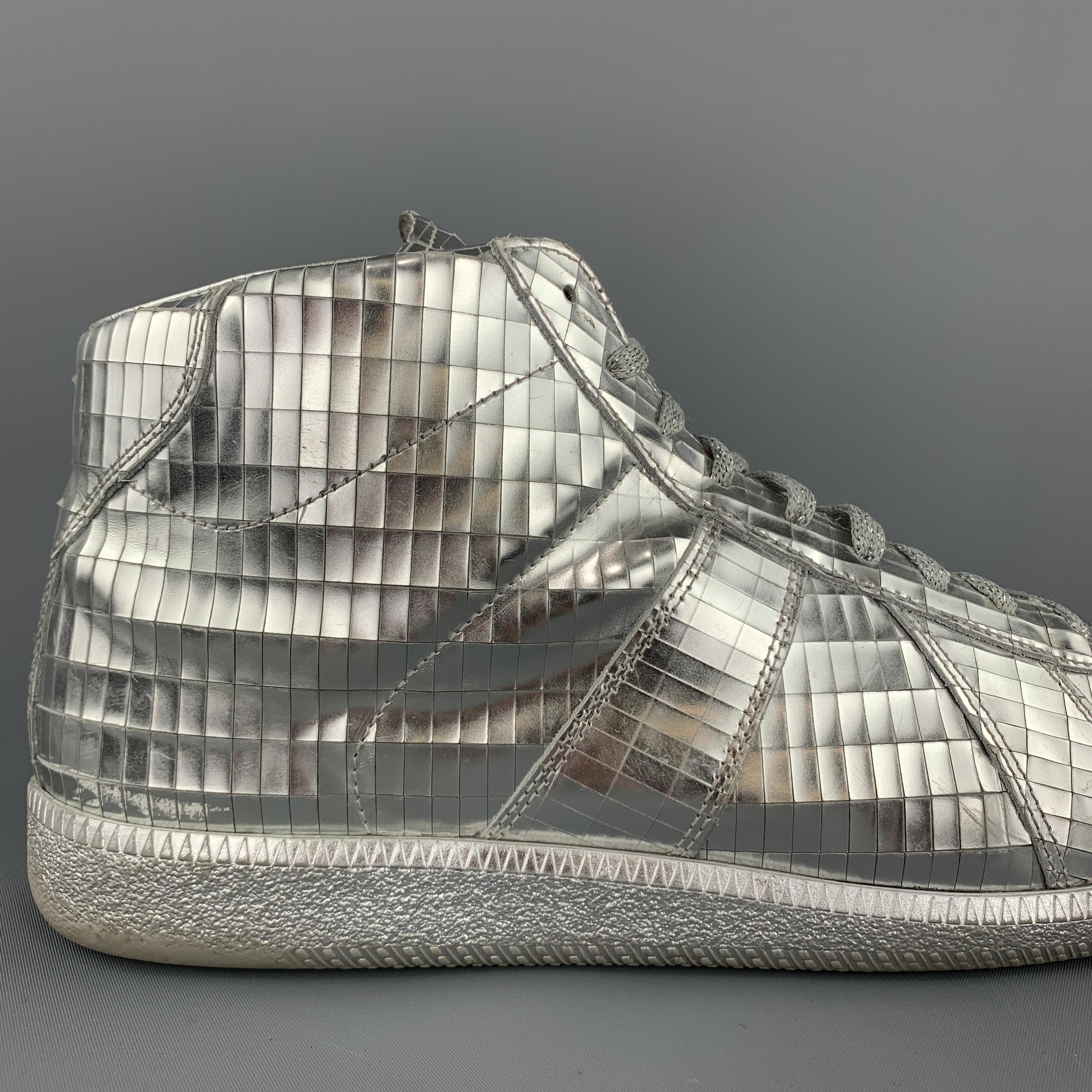 MAISON MARGIELA high top sneakers come in metallic silver Disco Ball textured leather with metallic rubber sole. Wear throughout. As-is. Made in Italy.

Fair Pre-Owned Condition.
Marked: IT 43

Outsole: 11.65 X 4 in.