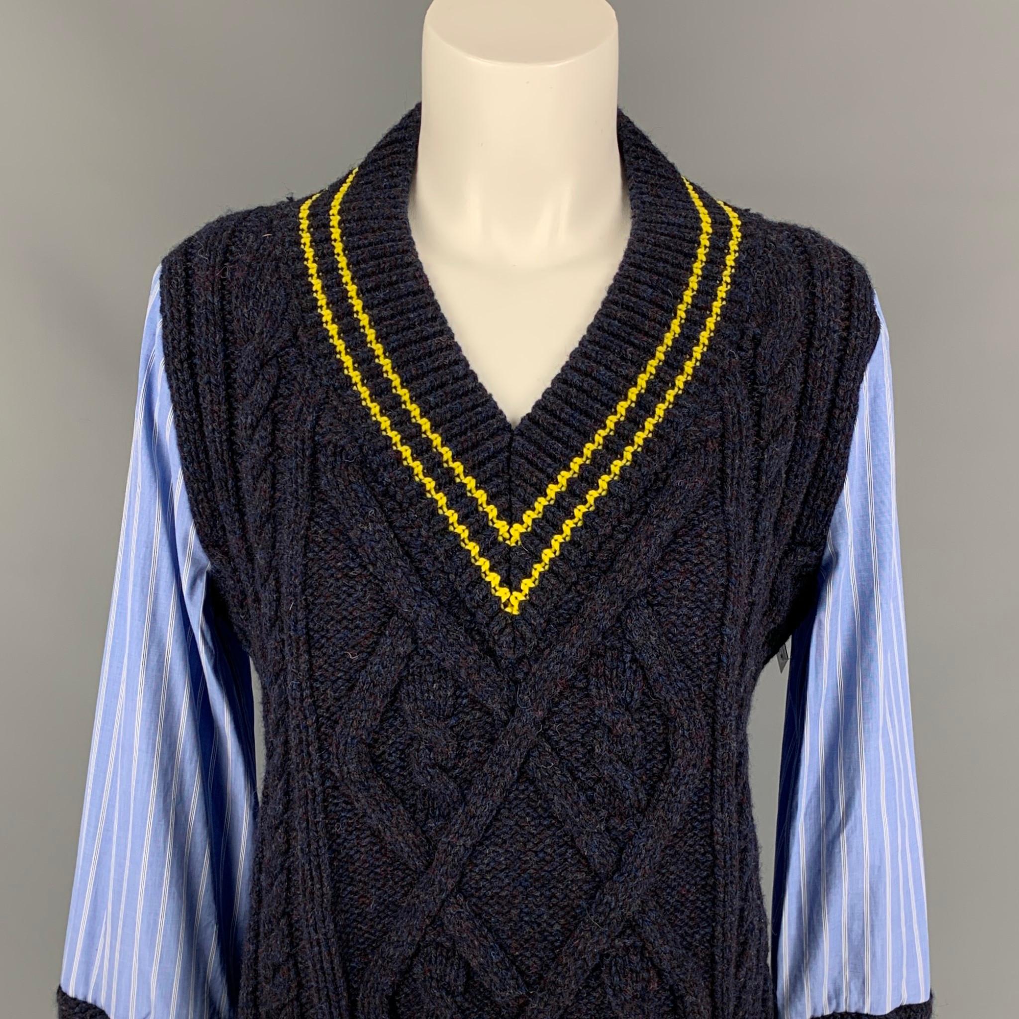 MAISON MARGIELA pullover comes in a blue & navy wool with stripe cotton sleeves & back featuring a yellow trim and a v-neck. Made in Italy. 

Excellent Pre-Owned Condition.
Marked: 40
Original Retail Price: $1,254.00

Measurements:

Shoulder: 16