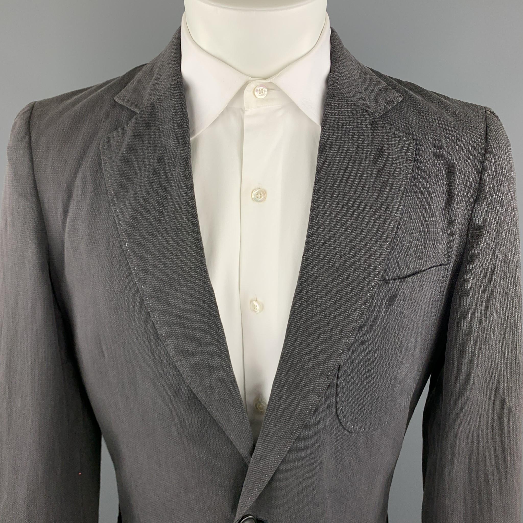 MAISON MARGIELA Sport Coat comes in a dark grey linen / cotton material, with a notch lapel, patch pockets, two buttons at closure, single breasted, functional buttons at cuffs, a double vent at back, unlined. As is. Made in Italy.

Very Good