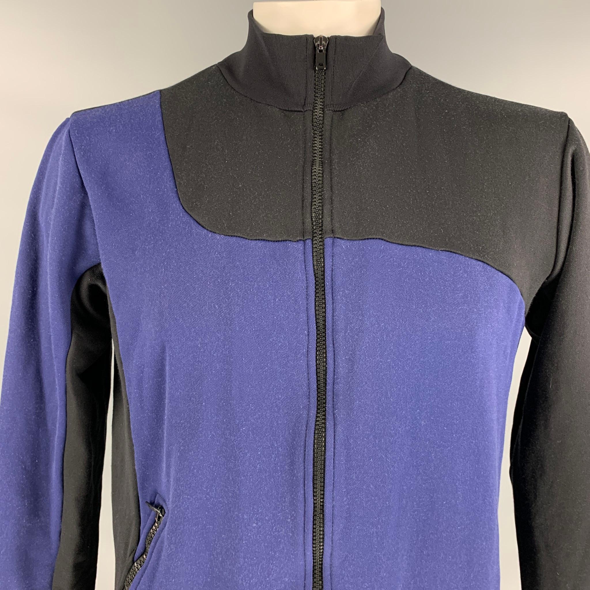 MAISON MARGIELA sweatshirt comes in a black & blue color block cotton / nylon featuring a high collar, zipper pocket, and a zip up closure. Made oin Italy. 

Good Pre-Owned Condition.
Marked: 52

Measurements:

Shoulder: 18.5 in.
Chest: 42
