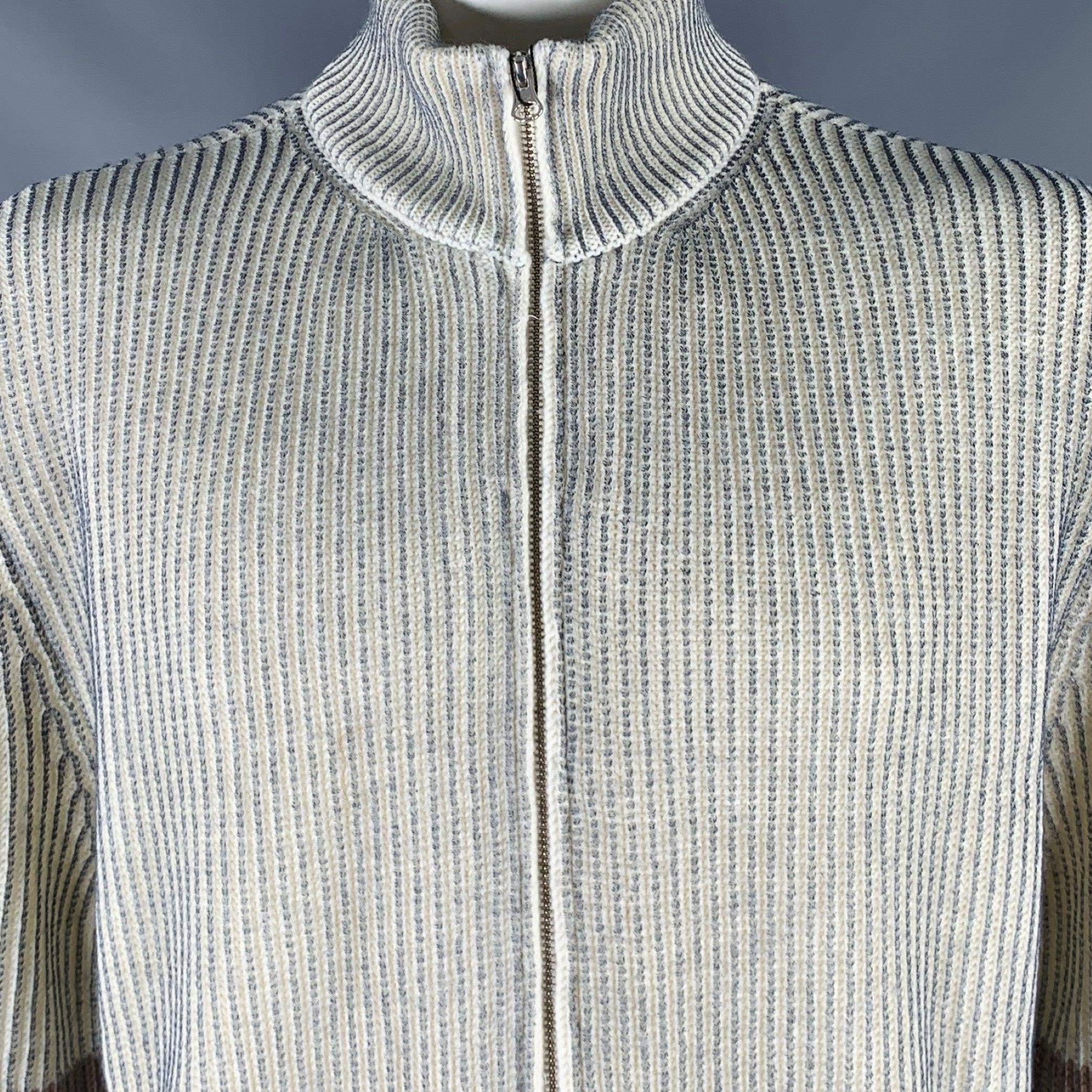 MM6 MAISON MARGIELA sweater
in a cream and grey acrylic wool blend knit featuring a two toned design, rib knit style, and zip up closure. Made in Italy.New with Tags. 

Marked:   L 

Measurements: 
 
Shoulder: 20.5 inches Chest: 50 inches Sleeve: 27