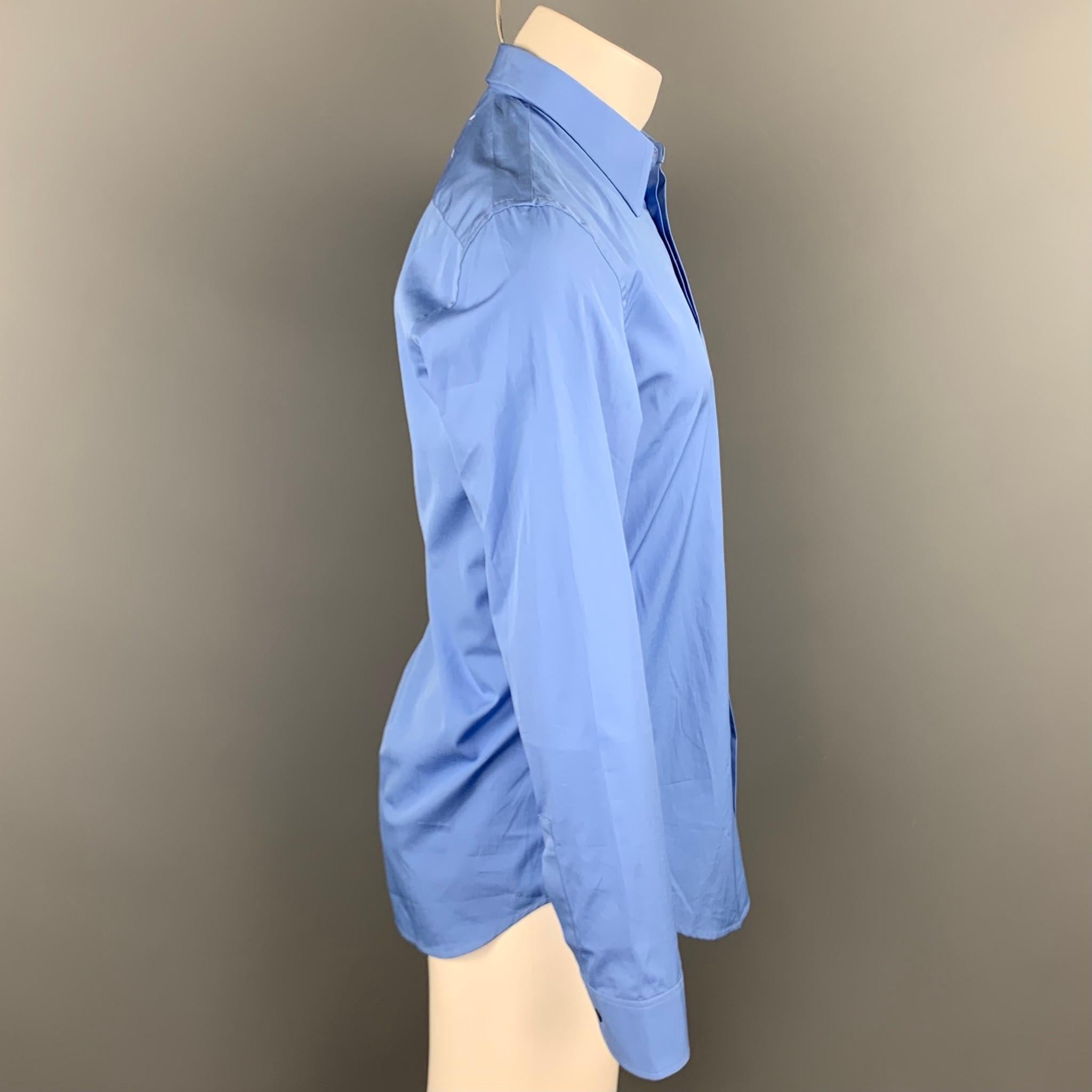 MAISON MARGIELA long sleeve shirt comes in a blue cotton featuring a spread collar and a hidden button closure. Made in Romania.

Very Good Pre-Owned Condition.
Marked: 40

Measurements:

Shoulder: 18 in.
Chest: 41 in.
Sleeve: 26 in. 
Length: 30.5