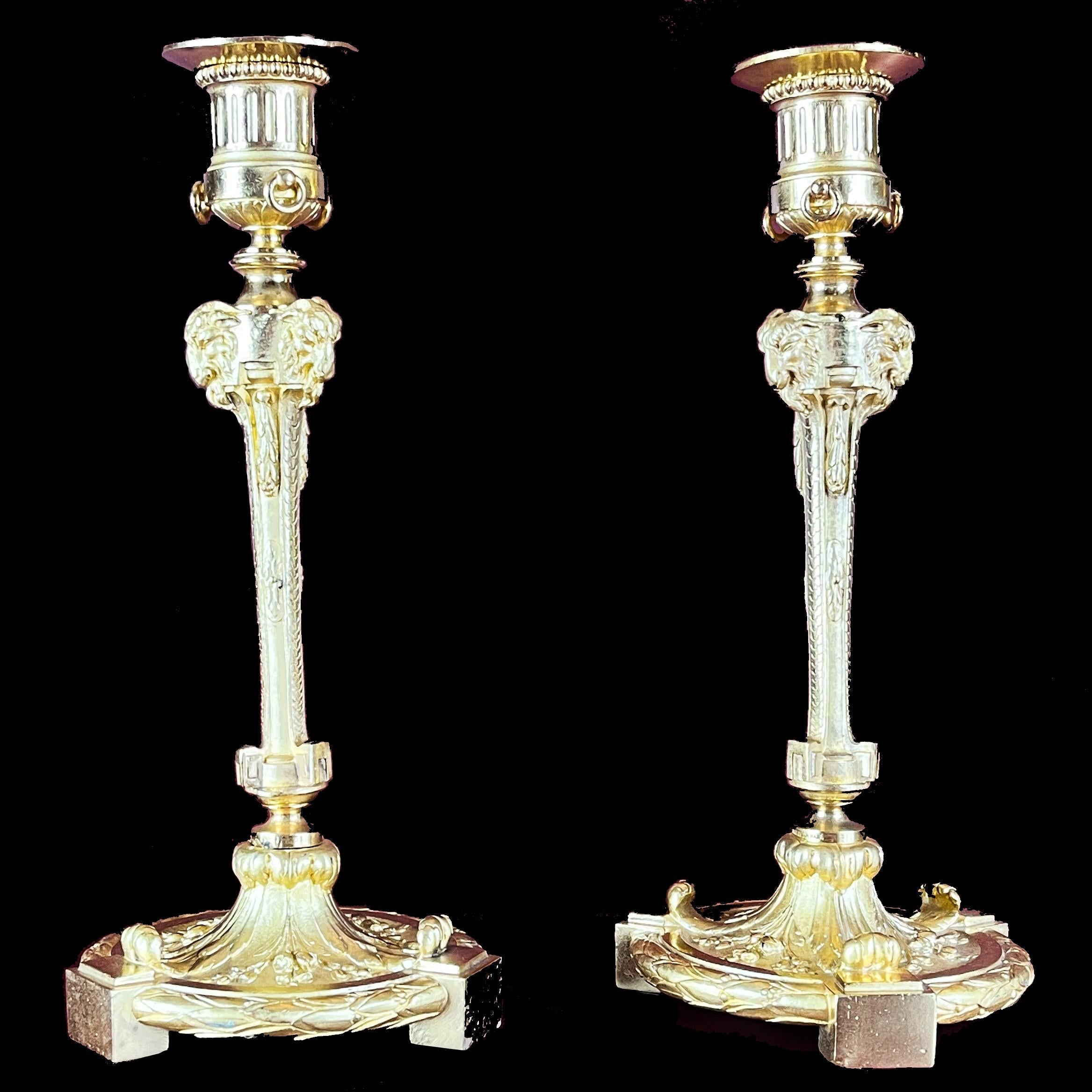 A rare pair of candle-holders in chiseled and gilt bronze in Louis XVI / 18th century style, signed by Maison Marnyhac and manufactured in the late 19th century.

Rich ornamentation in the Louis XVI's 