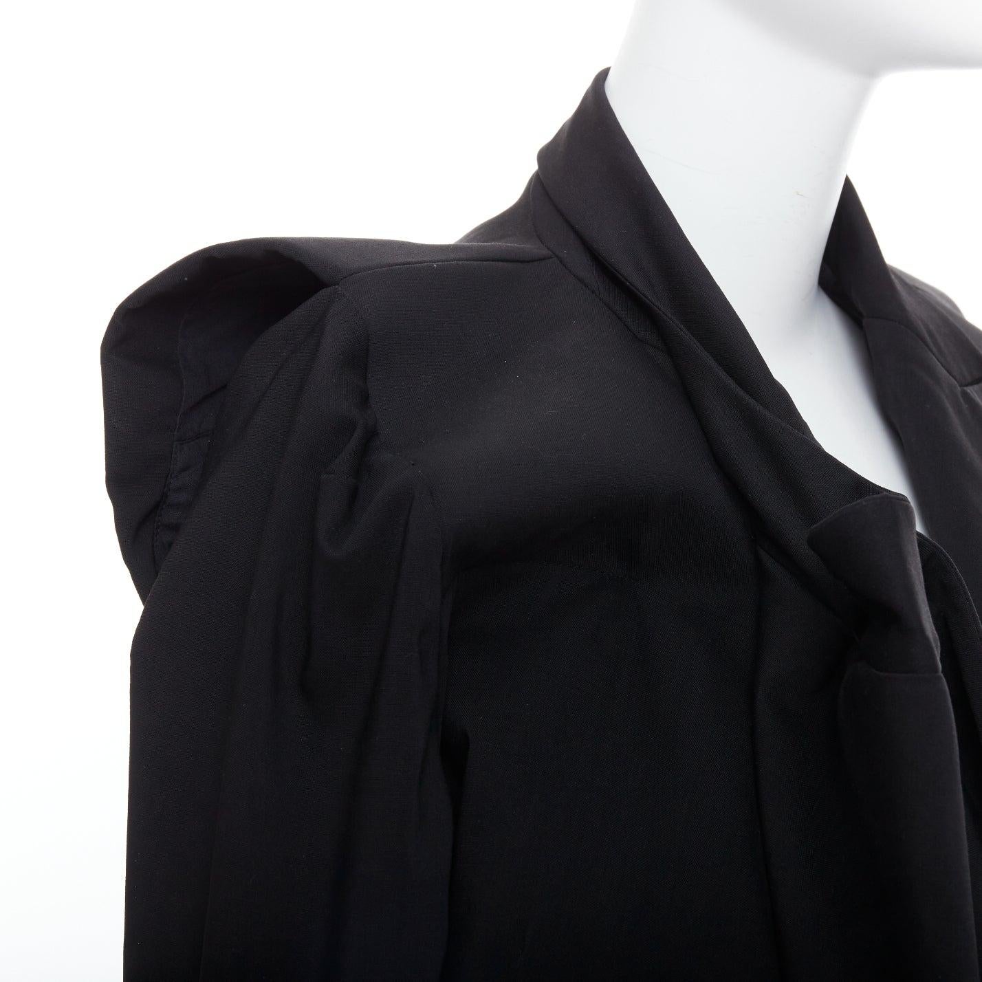 MAISON MARTIN MARGIELA 2001 Runway black deconstructed draped coat FR38 M
Reference: TGAS/E00157
Brand: Maison Margiela
Designer: Martin Margiela
Collection: Fall Winter 2001 - Runway
Material: Wool, Blend
Color: Black
Pattern: Solid
Closure: