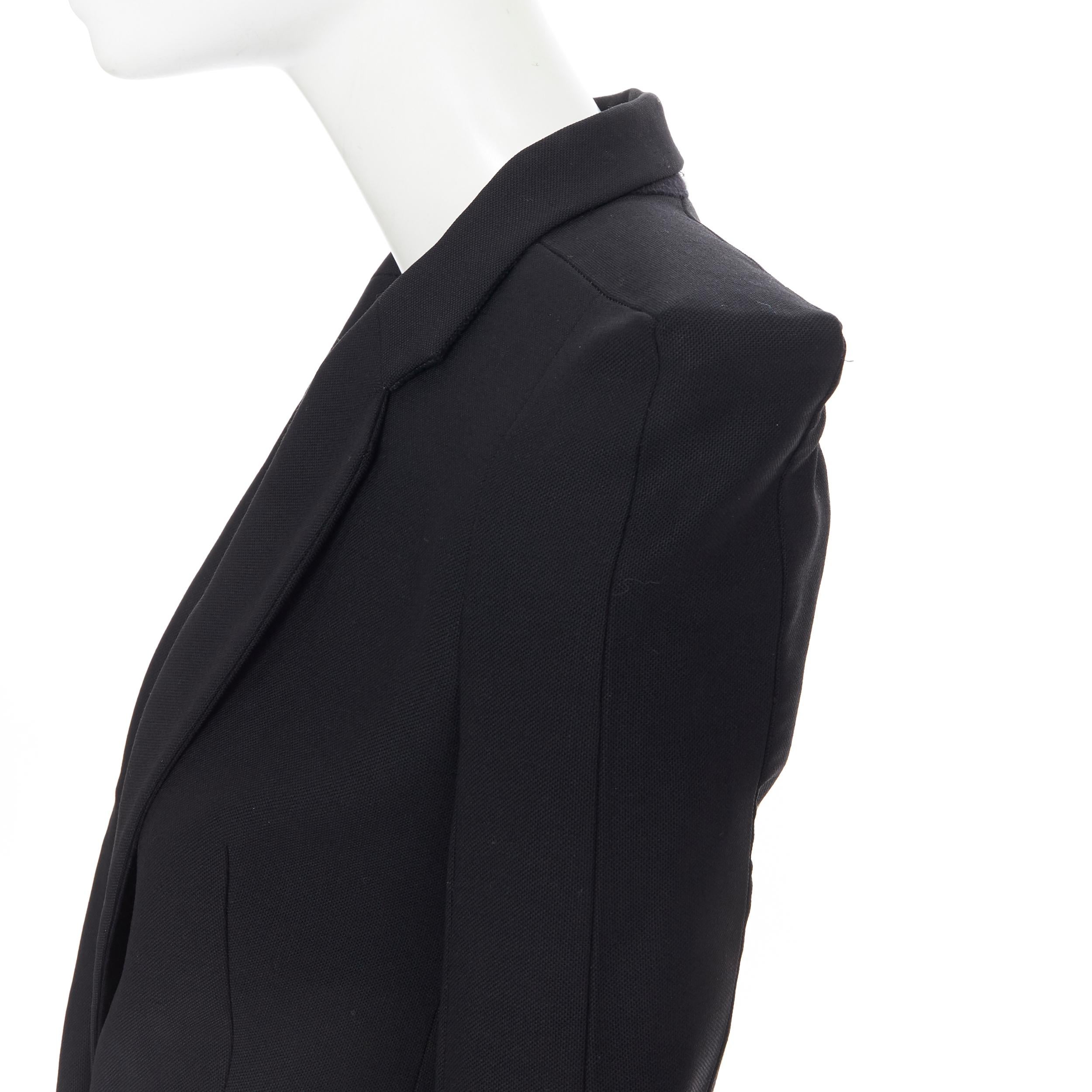 MAISON MARTIN MARGIELA 2007 square cut padded shoulder blazer jacket IT36 XS 
Reference: TGAS/A05510 
Brand: Maison Margiela 
Designer: Martin Margiela 
Collection: Fall Winter 2007 
Material: Wool 
Color: Black 
Pattern: Solid 
Closure: Button
