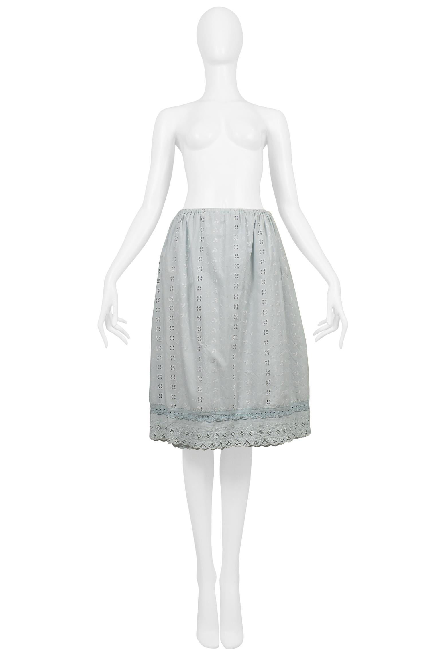 Resurrection Vintage is excited to offer a vintage Maison Martin Margiela light blue eyelet lace artisanal skirt made from two vintage lace skirts, one side is covered in a light blue eyelet pattern and the other side in white with light blue eyelet