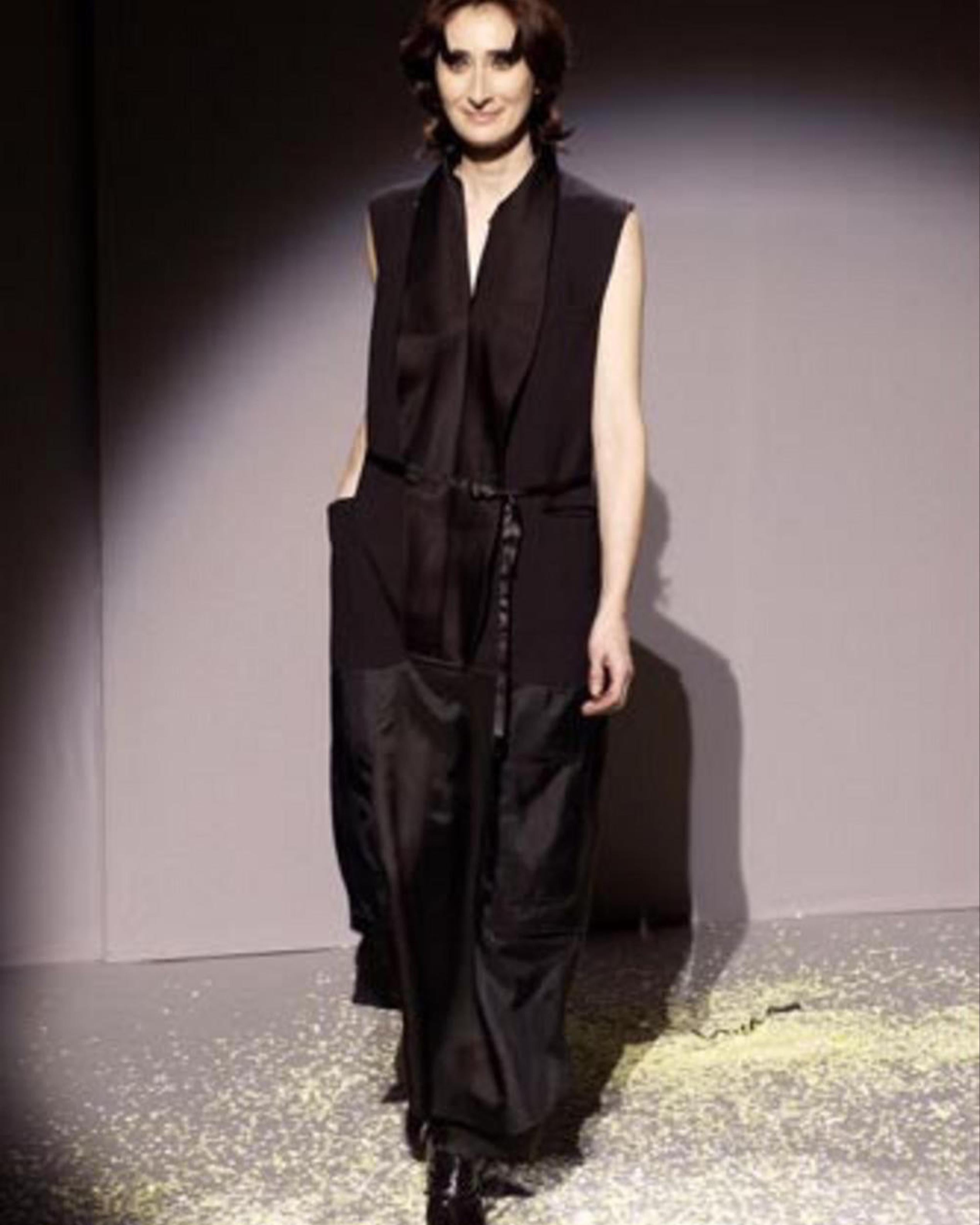 - Designed by Martin Margiela
- Sold by Skof.Archive
- Fall Winter 2003 
- Artisanal Collection
- Sleeveless Reconstructed Black Vest
- Button Closure
- Lace Belt
- Multilayered Bottom
- Sleeveless design
- Excellent Condition
- Made in France
-