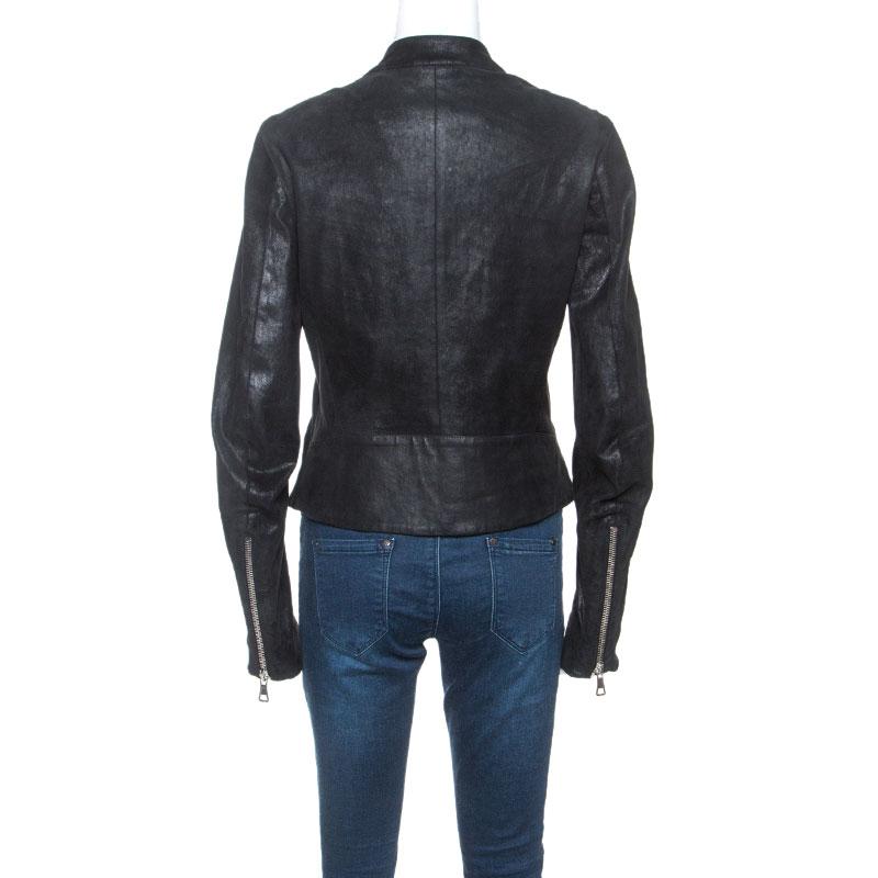 There's just some fashion magic that leather jackets bring to one's closet. They are a staple for one's style. Maison Martin Margiela brings you this black jacket beautifully tailored from leather and designed with long sleeves, full zip closure and