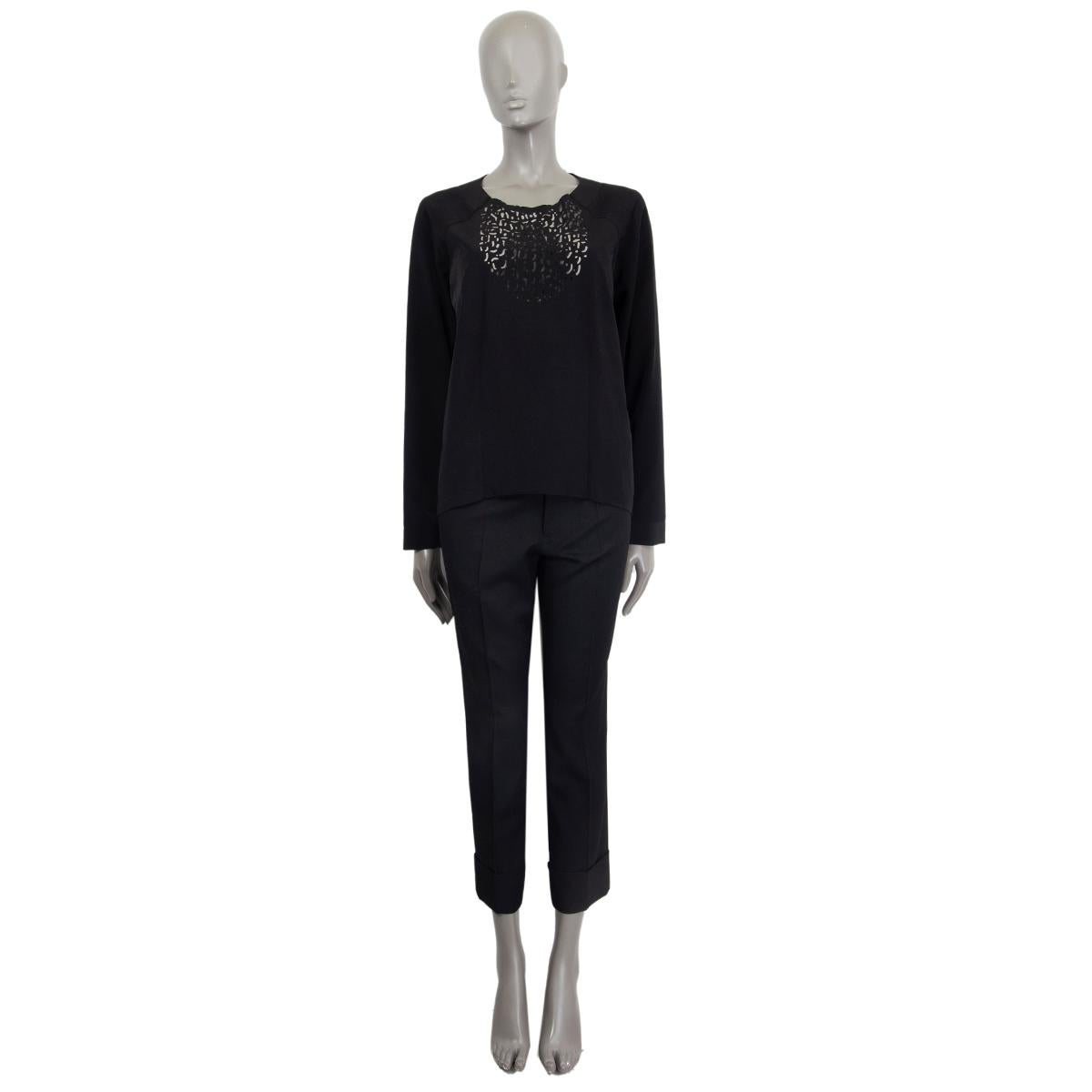 100% authentic Maiso Martin Margiela long-sleeve round-neck top in black polyester (100%). Laser cut-out detail on chest. Opens with a zipper on the back. Has been worn and is in excellent condition. 

Measurements
Tag Size	42
Size	L
Shoulder