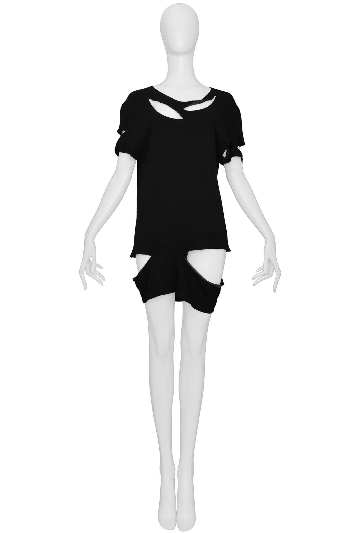 Resurrection Vintage is excited to offer a vintage Maison Martin Margiela black cotton and wool jersey tunic top featuring short sleeves, tunic length, scoop neckline, and multiple slashes with a rubberized interior finish. 

Maison Martin