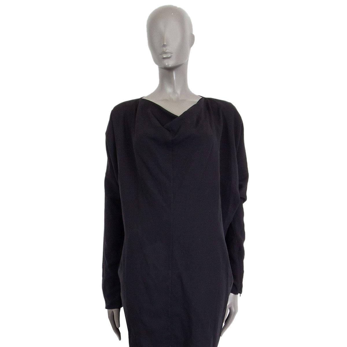 
100% authentic Maison Martin Margiela long sleeve oversized dress in black wool (100%) with a draped neck-line, a vertical cut along the mid-frontal line and with zipped sleeves hems. Unlined. Has been worn and is in excellent