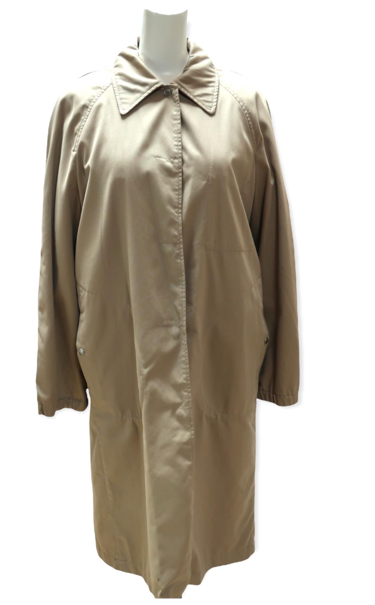This long coat comes from Maison Martin Margiela. The inner detachable layer is soft and light and feels like you're wearing a blanket. It has a long zippered front. The outer trench style layer will insulate you from chilly weather. It has a snap