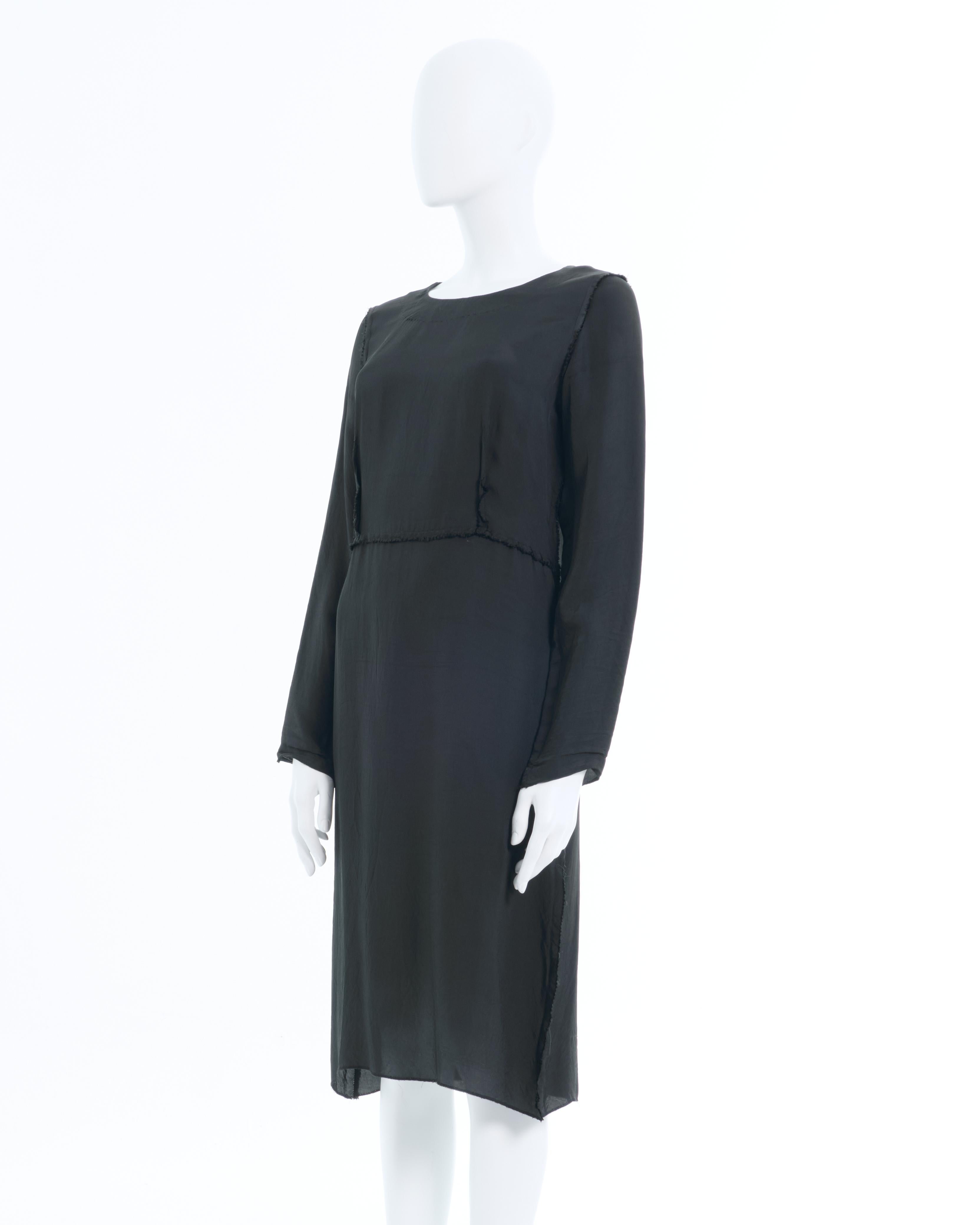 - Maison Martin Margiela black silk dress
- Designed by Martin Margiela 
- Fall-Winter 2005 'Inside Out'
- The seams and darts are left unfinished on the outside, - giving the illusion of the dress being worn inside out 
- The hems on the neckline
-
