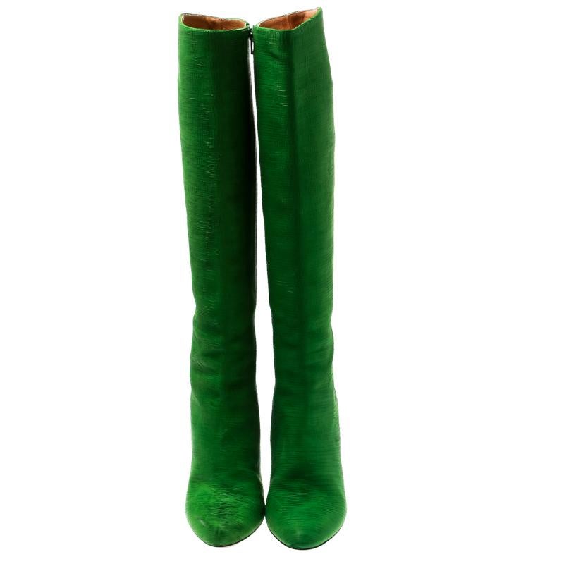 Maison Martin Margiela brings you this fabulous pair of knee length boots that will give you confidence and loads of style. They've been crafted from textured suede in a breathtaking shade of green and styled with cone heels bound to lift you with
