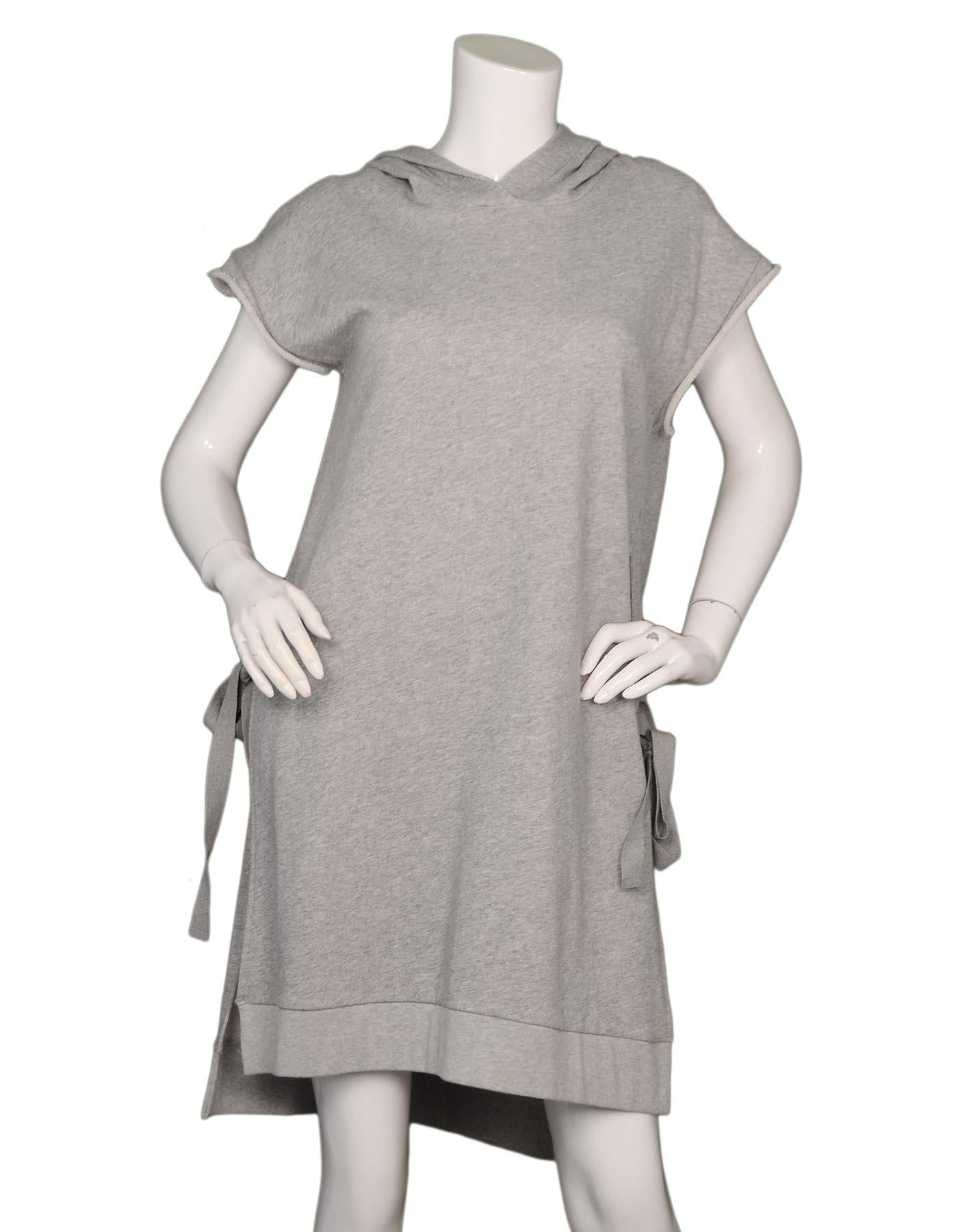 Maison Martin Margiela Grey Hooded Side Tie Sweatshirt Dress Sz M

Made In: Turkey
Color: Grey
Materials: 100% cotton
Opening/Closure: Pull over
Overall Condition: Excellent pre-owned condition 

Measurements: 
Shoulder To Shoulder:   21