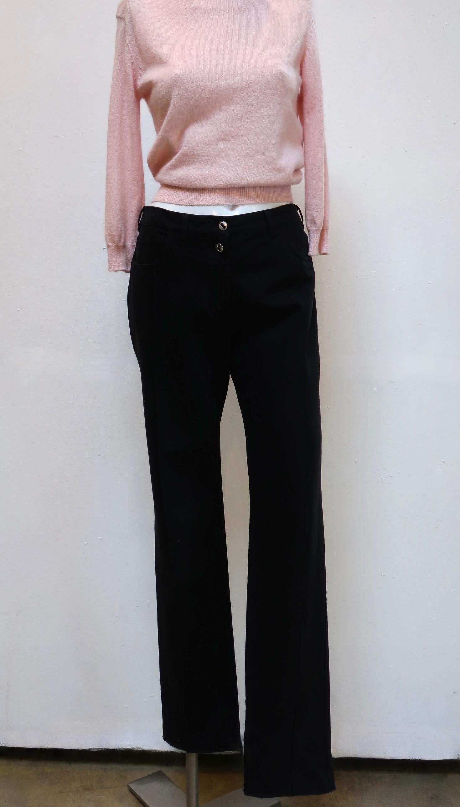 These casual high cut black pants from Maison Martin Margiela have narrow legs and are a sturdy textured cotton. Front seams, extending down from the front pockets, elevate these pants. 