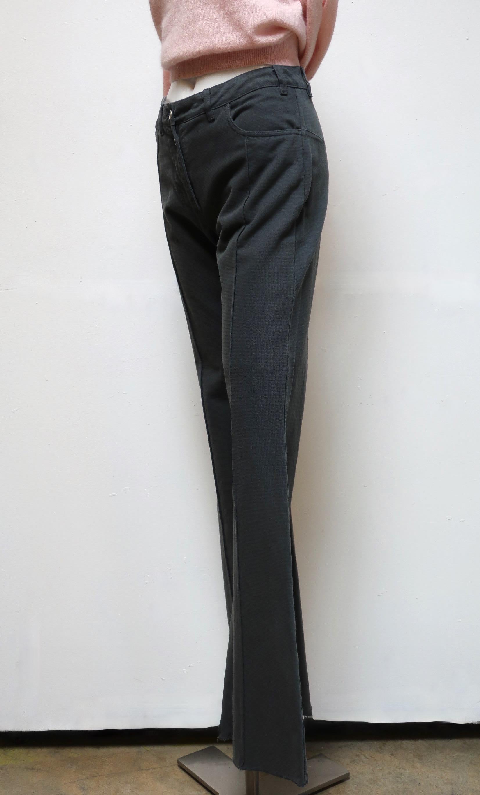 Grey pant from vintage Maison Martin Margiela is a high-cut style with wide legs. They feature distinctive front seams that extend down from the two front pockets and a half snap/half button fly.. 