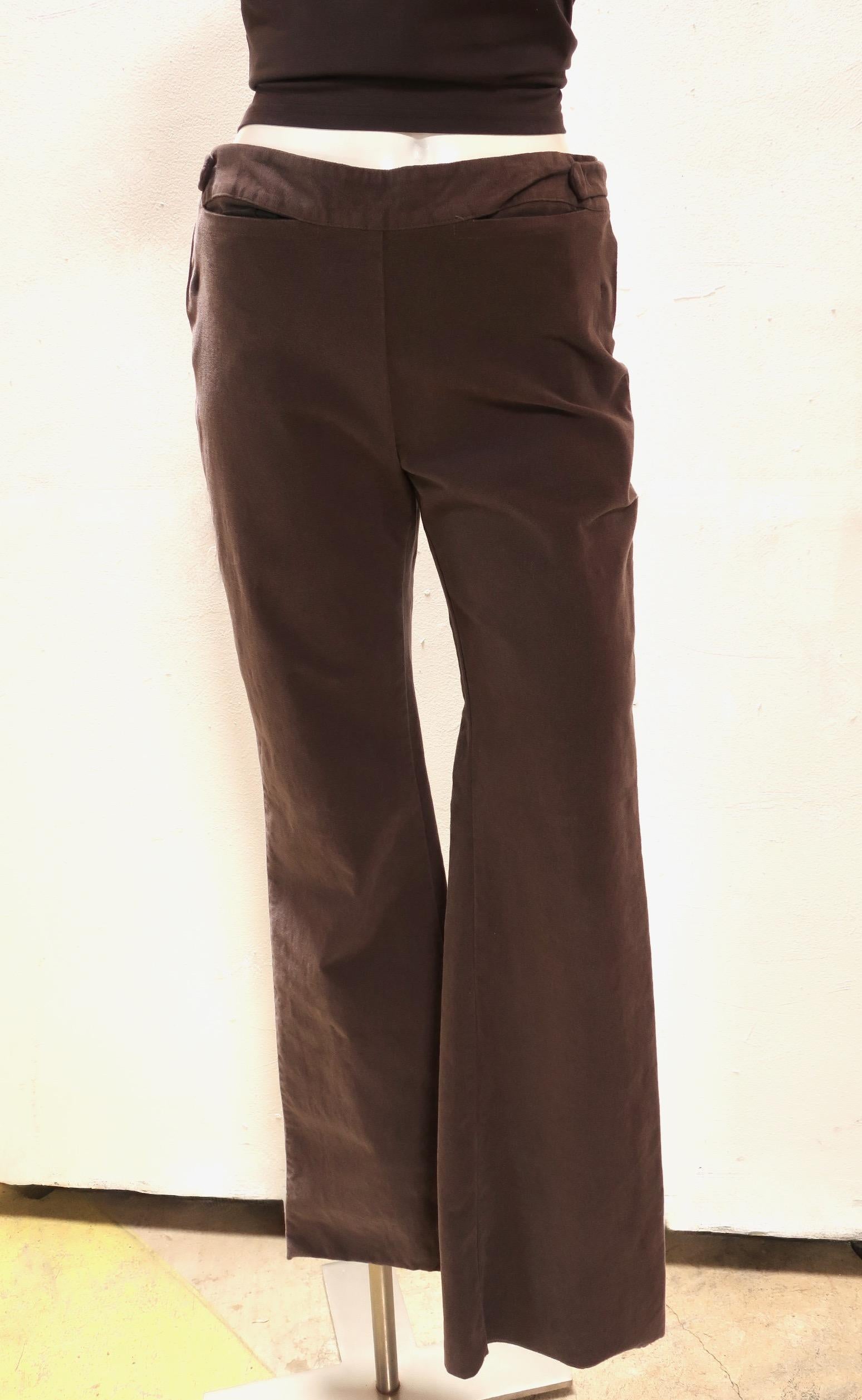Soft flannel high cut pant from Maison Martin Margiela features wide legs for a bohemian look. Two front pockets open horizontally, just below the waistband. in the absence of a front fly, the pants close at the sides with buckles and adjustable