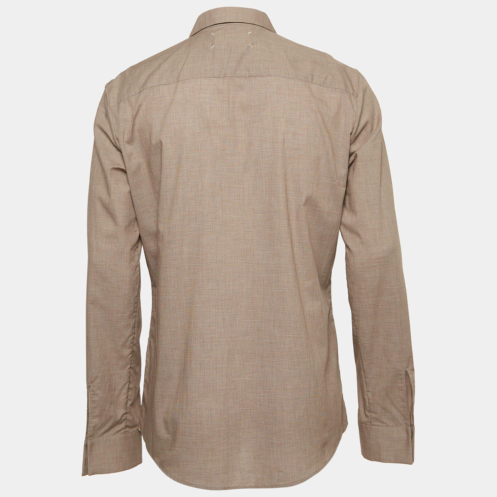 Shirts are an indispensable part of a wardrobe so this brand brings you a creation that is both versatile and stylish. It has been tailored from quality material in a versatile shade. The shirt is detailed with signature elements and a comfortable