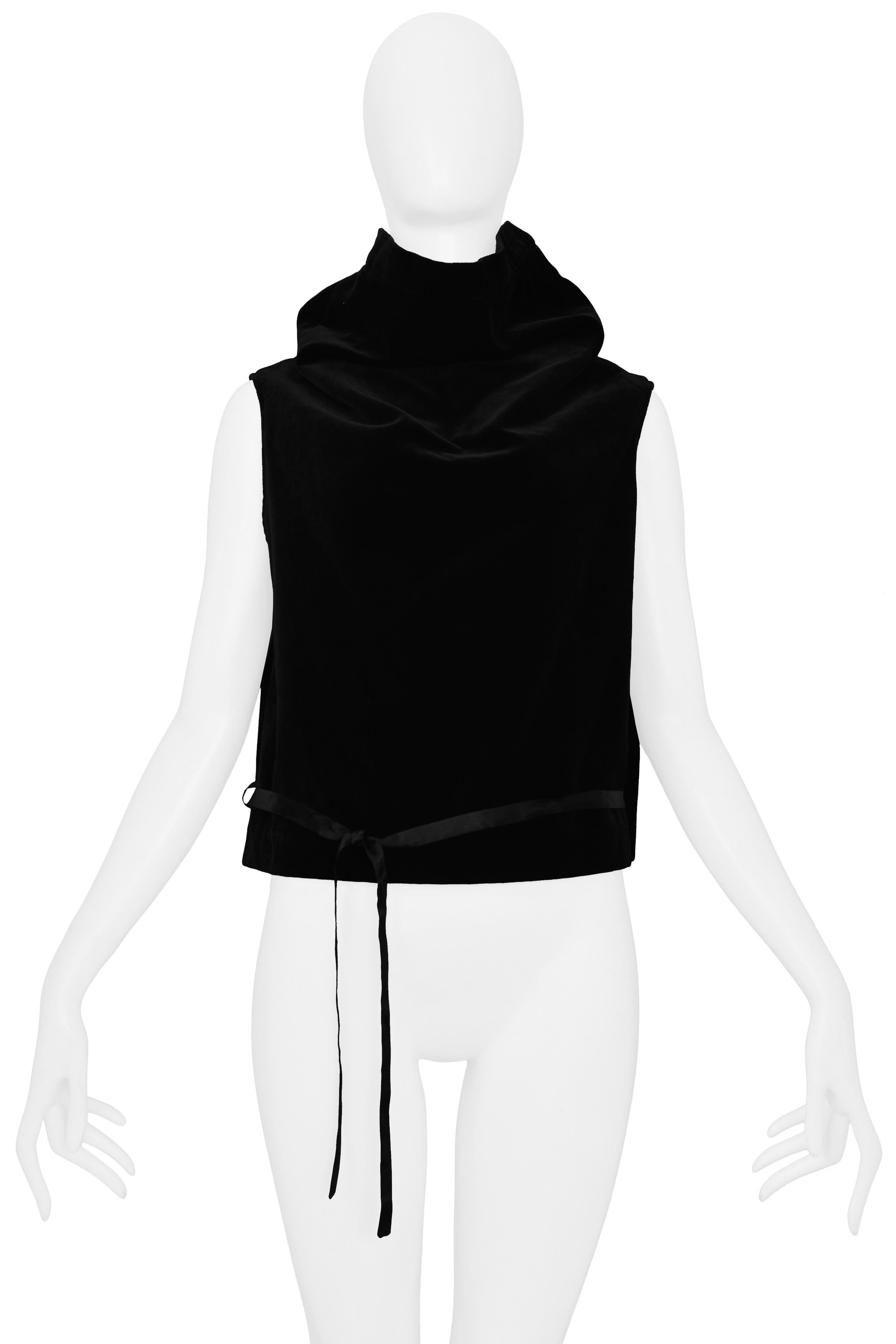 Resurrection Vintage is excited to offer a vintage Maison Martin Margiela artisanal black velvet top made from a skirt pattern. The sleeveless top features a classic skirt waistband and zipper that acts as a collar, black rayon lining, and a black