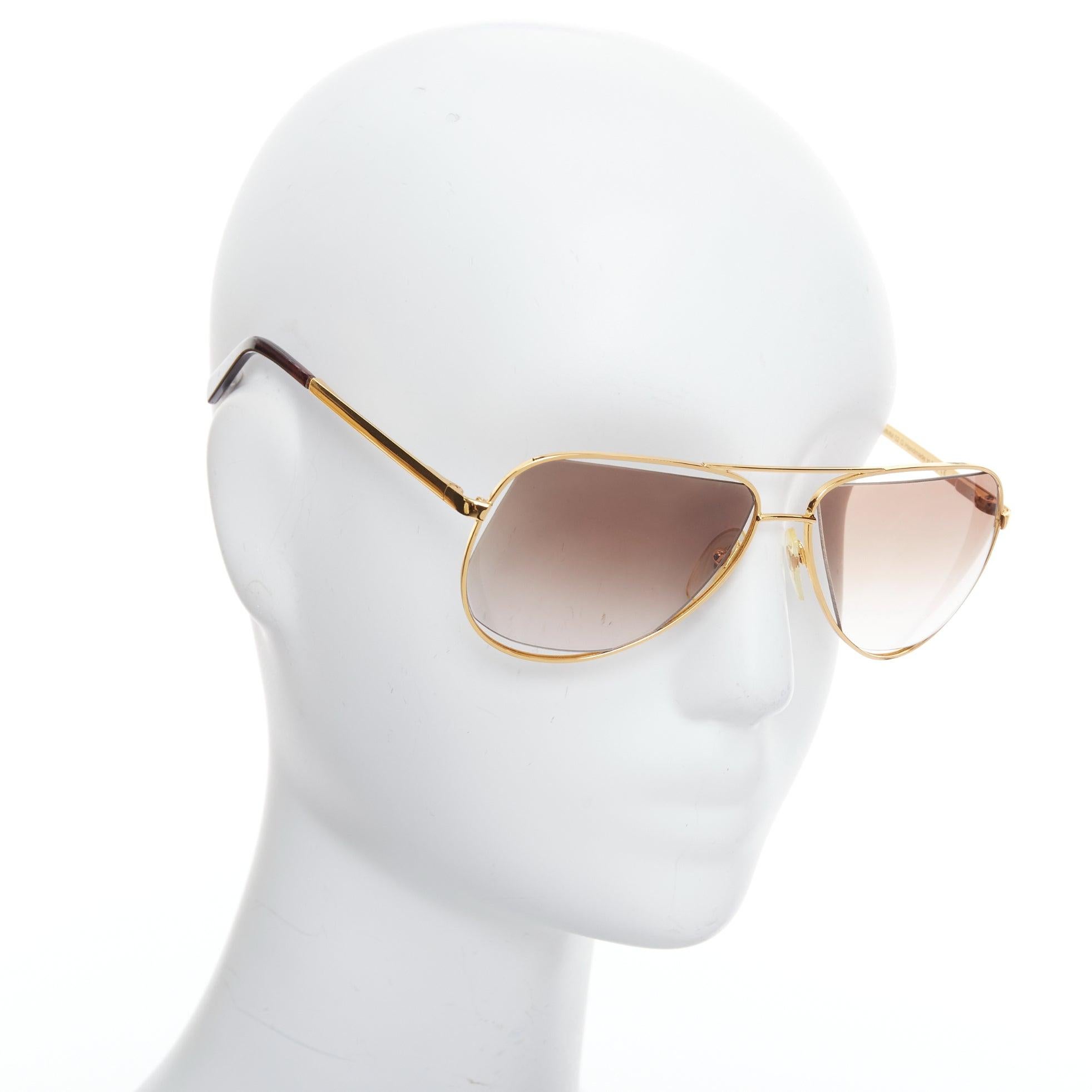 MAISON MARTIN MARGIELA MYKITA MMM02G gold cut out aviators
Reference: AEMA/A00115
Brand: Maison Margiela
Model: MMM02G
Collection: MYKITA
Material: Metal
Color: Gold, Brown
Pattern: Solid
Extra Details: Gold sides.
Made in: