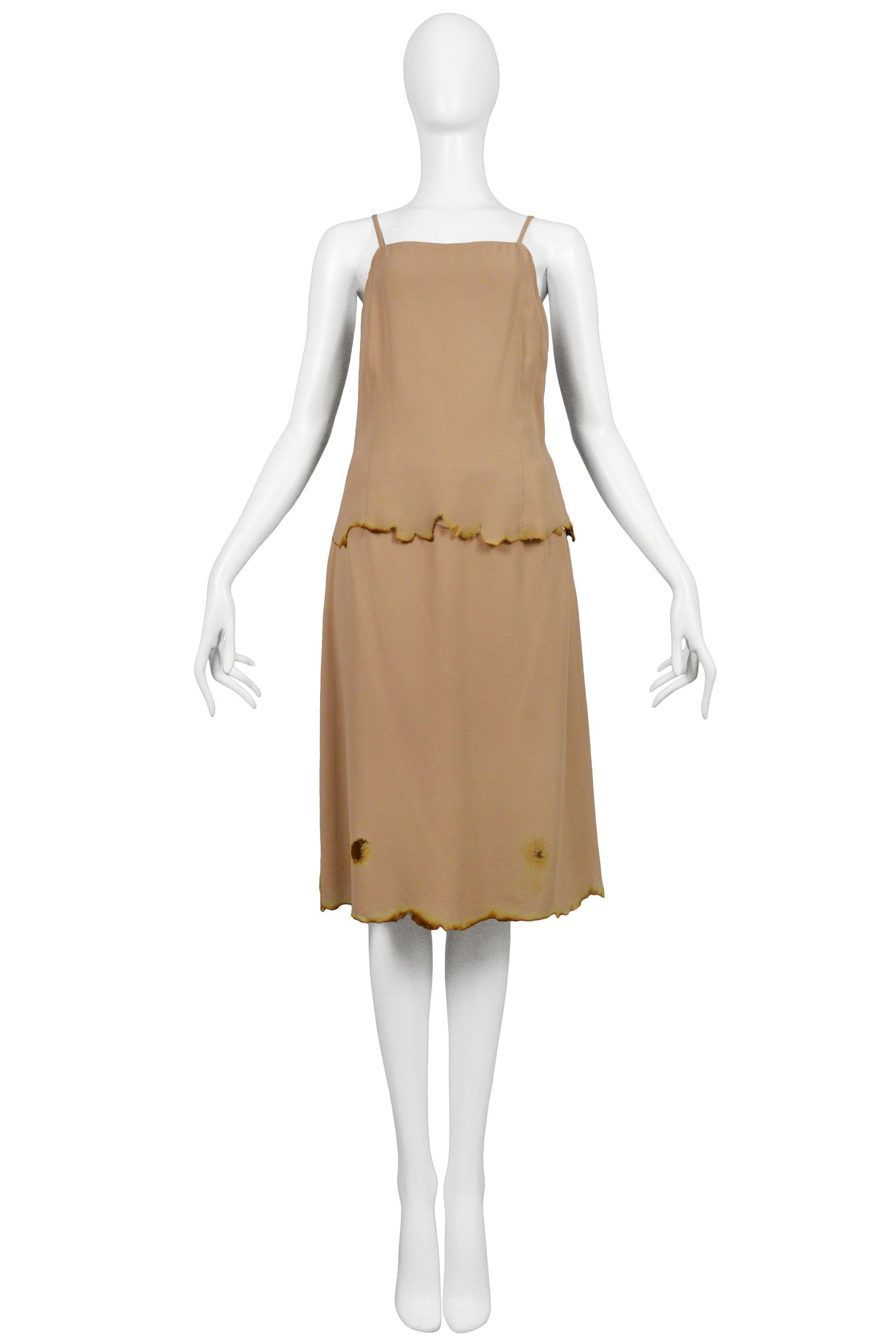 Vintage Martin Margiela nude color spaghetti strap camisole and matching knee-length skirt both featuring singed edges along the hems. Circa the early 2000's.

Maison Martin Margiela
Artisanal
Size: 38
Wool and Crepe
2000s Collection
Excellent
