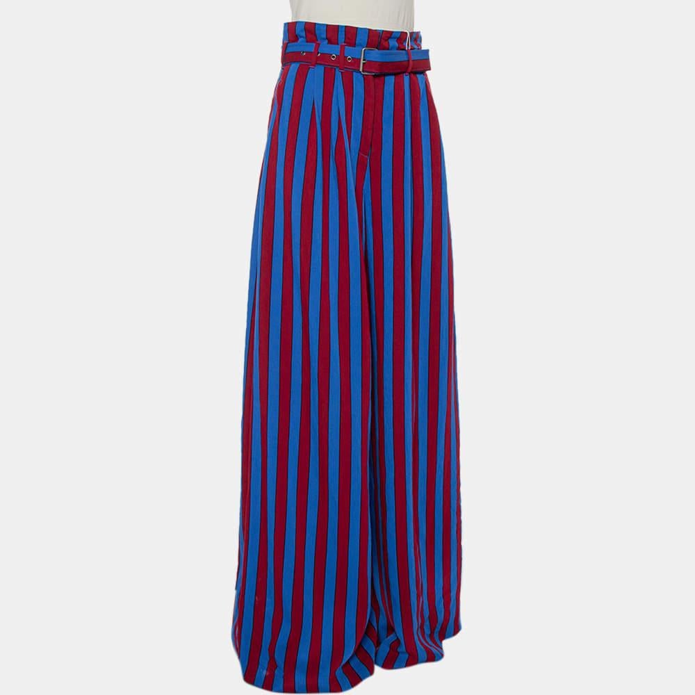 These palazzo pants from Maison Martin Margiela deserve a place in your wardrobe. Covered in stripes of red and blue, the pair is secured with a front zip closure and enhanced with a matching belt.


