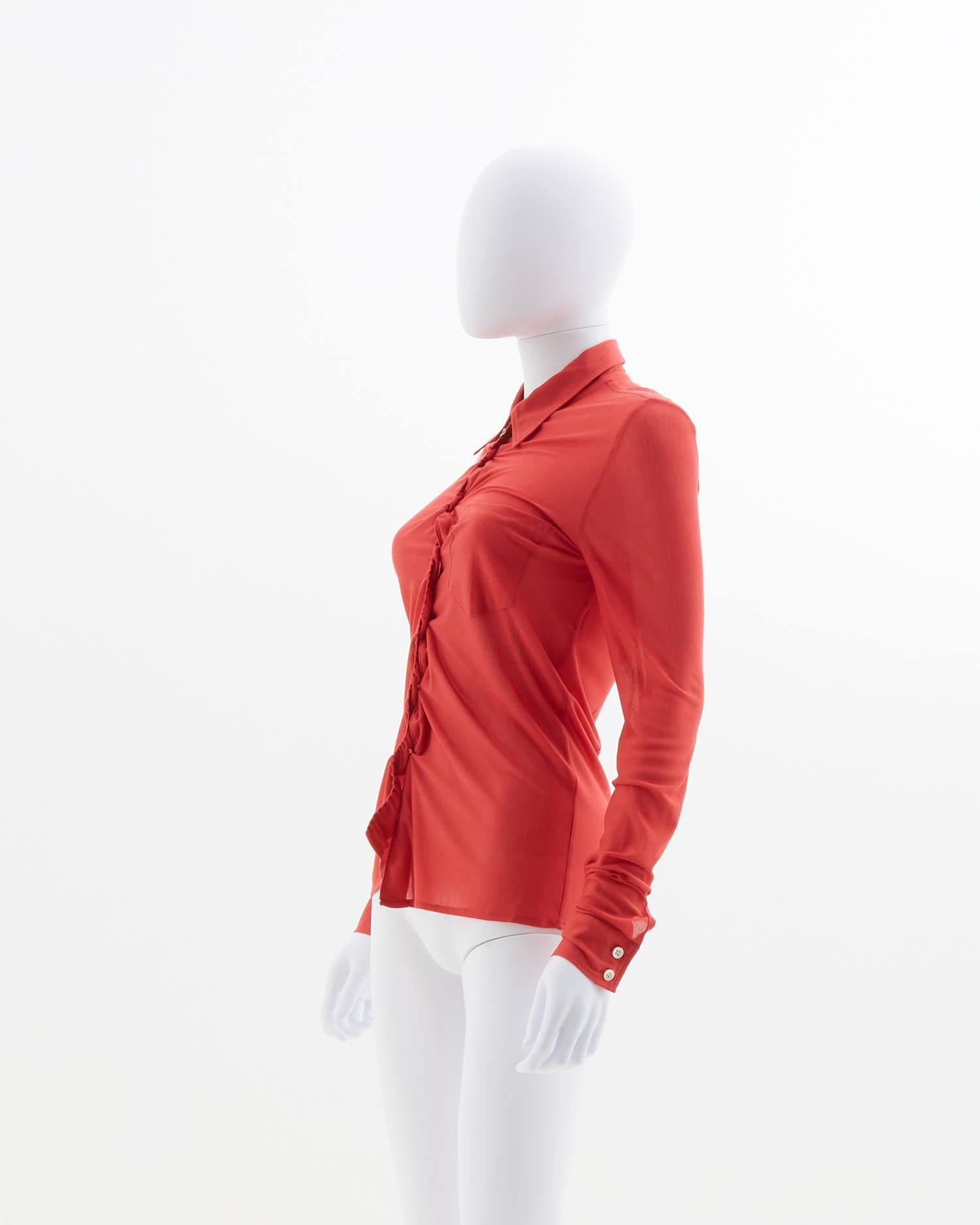 - Designed by Martin Margiela
- Sold by Skof.Archive
- Red shirt 
- Plastic coulisse detail referenced on Look 13
- Button closure 
- Spring Summer 2001
- Made italy 

Size:
FR 38 - IT 42 - UK 10 - US 6 (EU)

Composition : 
100%