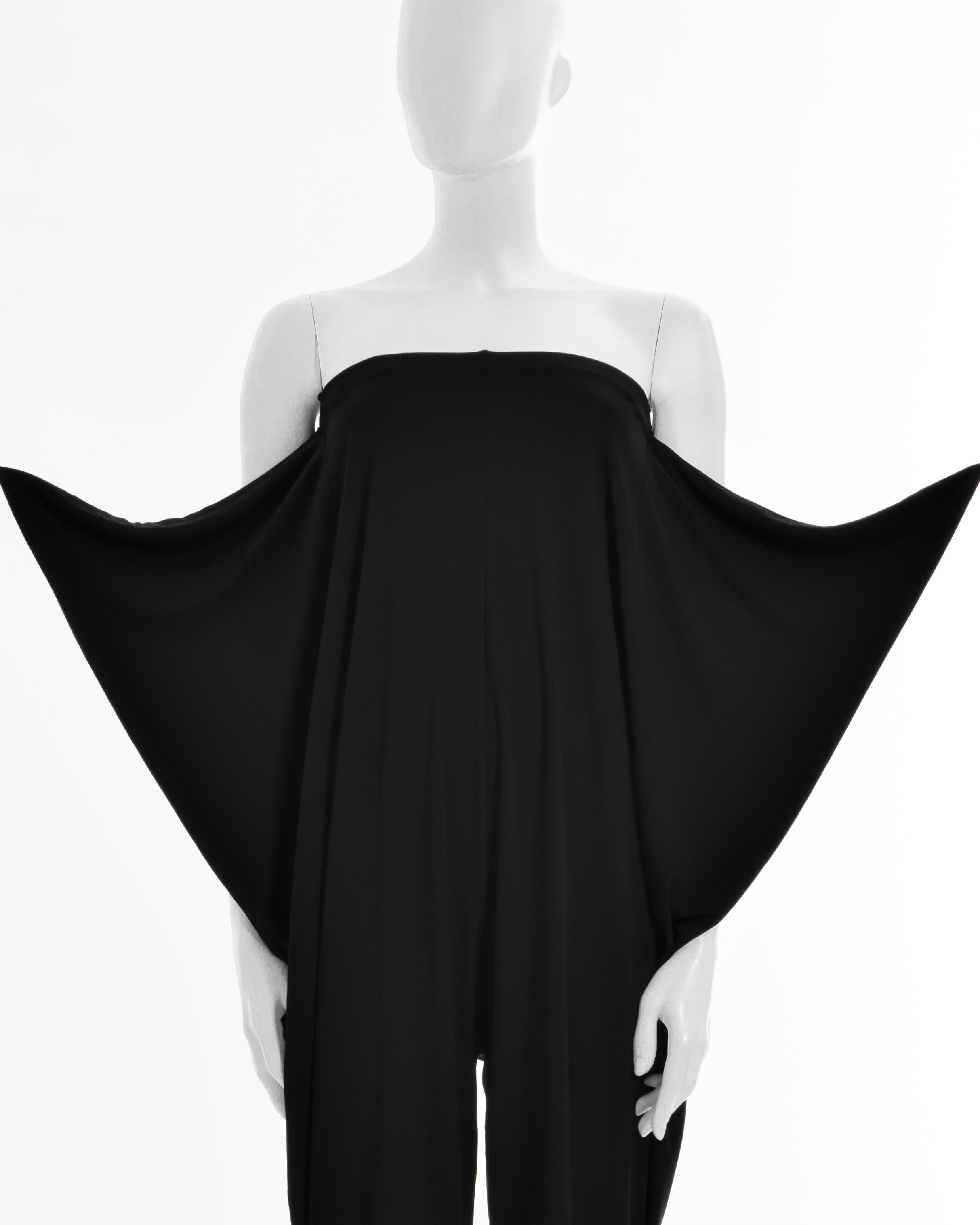 - Maison Martin Margiela black viscose jumpsuit
- Sold by Skof.Archive 
- Shoulders off 
- Adjustable panels on the back 
- Silicon bust line
- Size: FR 36 - IT 40 - UK 8 - US 4 (EU) 
- Fabric: 100% Viscose
- Made in Italy
- Mint Conditions
