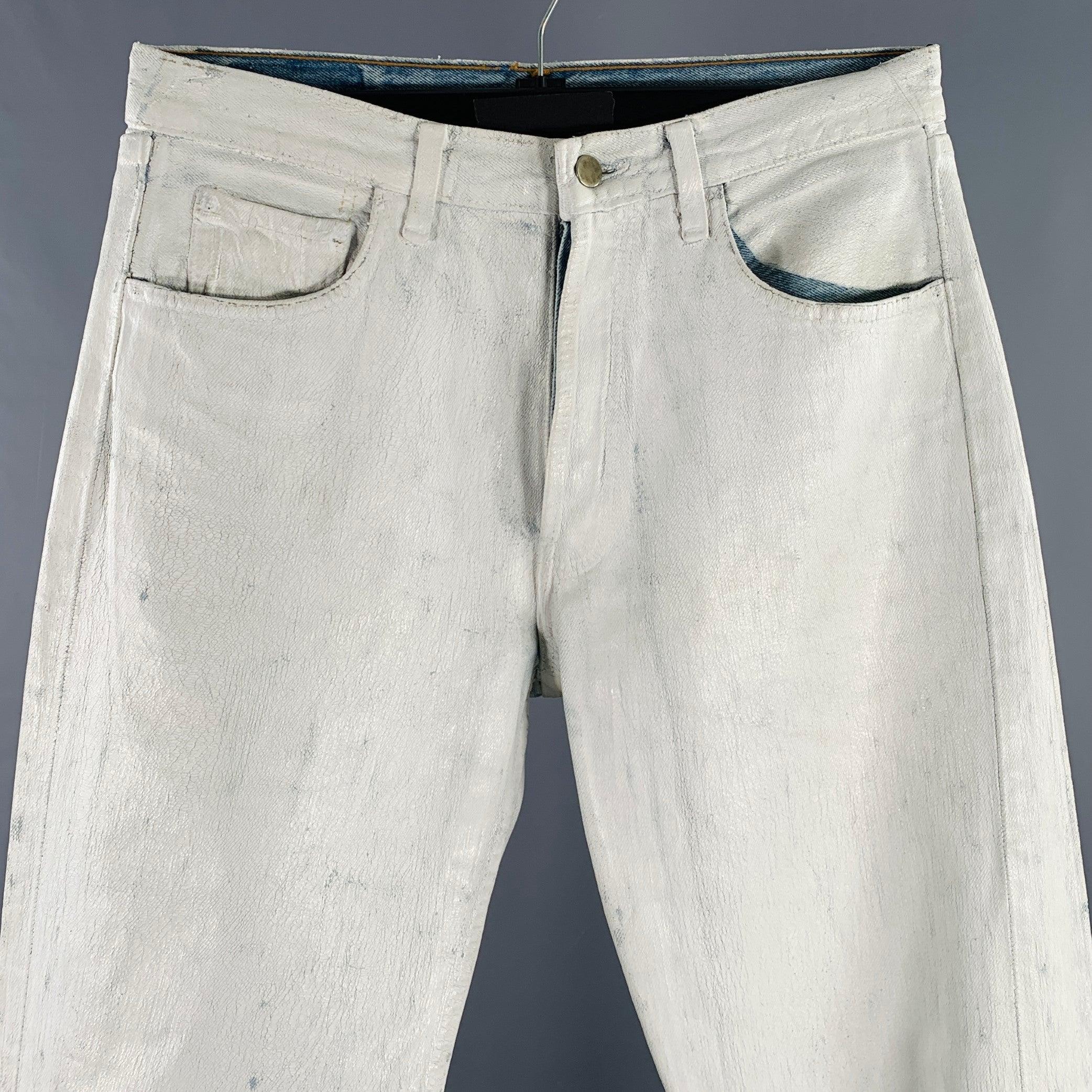 MAISON MARTIN MARGIELA Men's Artisanal Line
jeans in a white painted blue denim featuring a painted design, five pockets, and button fly closure. Made in France.Excellent Pre-Owned Condition. 

Marked:   M. Numbers 0 and 10 are circled on brand tag