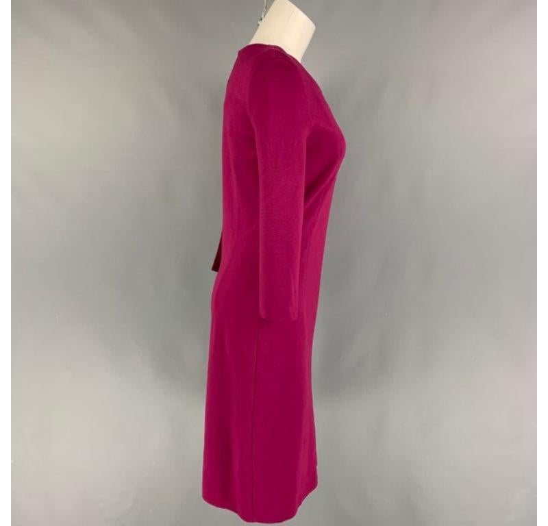 MAISON MARTIN MARGIELA cocktail dress comes in a raspberry viscose blend featuring a ribbed panel design, long sleeves, and a side zipper closure. Made in Italy.
Very Good
Pre-Owned Condition. 

Marked:   40 

Measurements: 
 
Shoulder: 15 inches