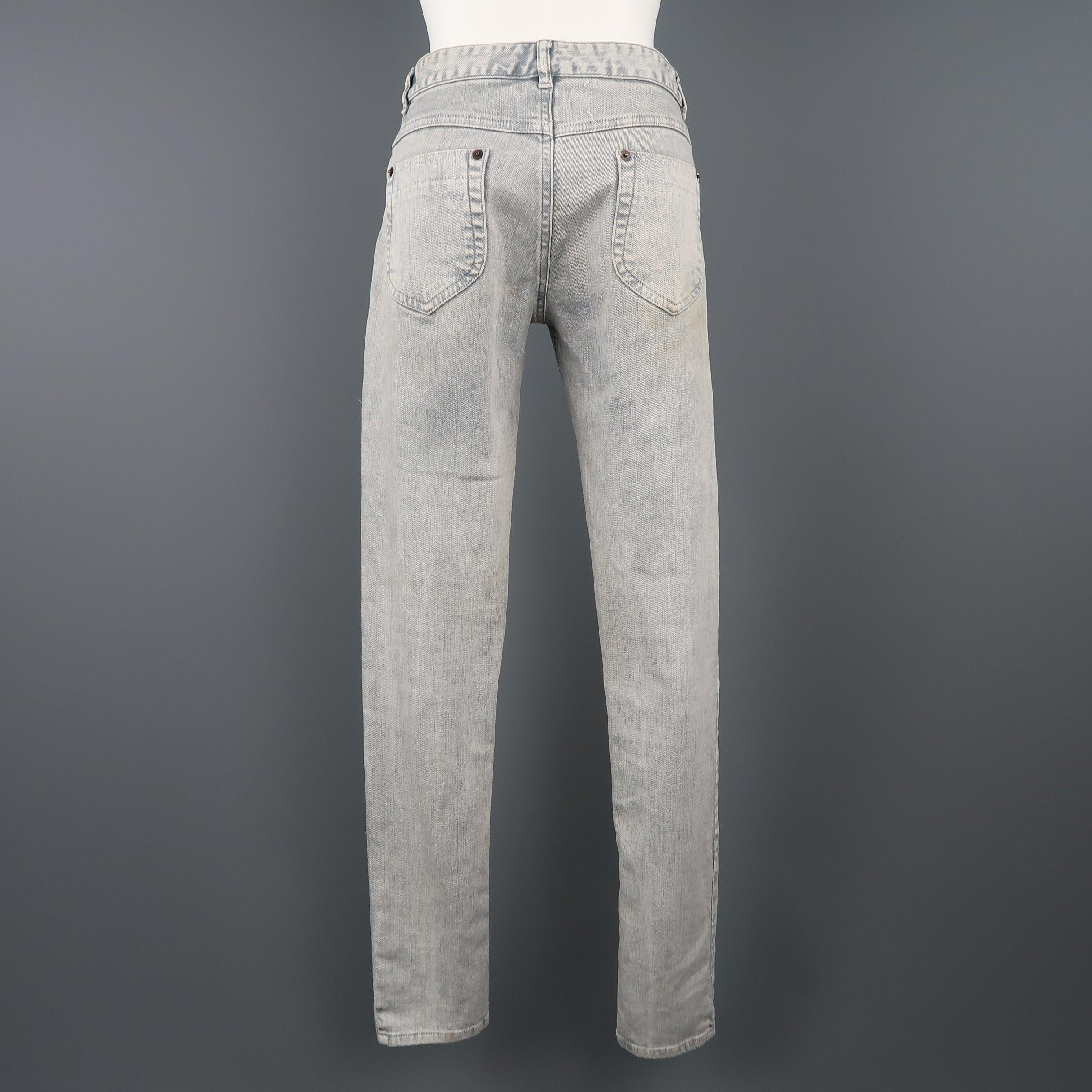 MAISON MARTIN MARGIELA jeans come in a light gray acid wash stretch denim with a narrow leg. Discolorations throughout and tag stitches undone. As-is. Made in Italy.
Fair Pre-Owned Condition.
 

Marked:   IT 42
 

Measurements: 
  
l	Waist: 29